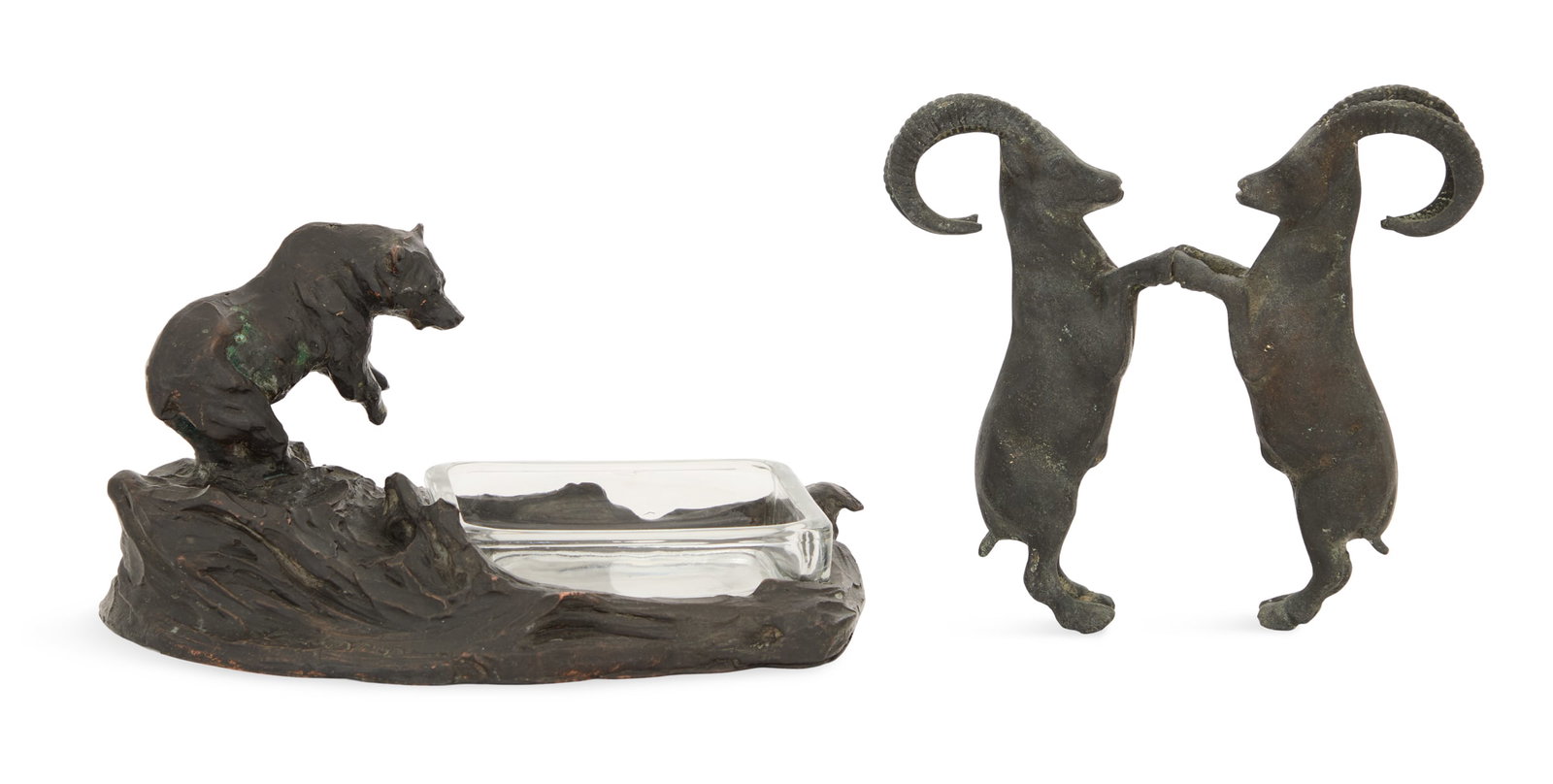 Two Bronze Animal Figures: Two Bronze Animal Figures 20th century, one example of a bear staring into a pool fitted with a glass ashtray, illegibly signed, h. 4", w. 8", d. 5-1/2", and the other example of a pair of bighorn she