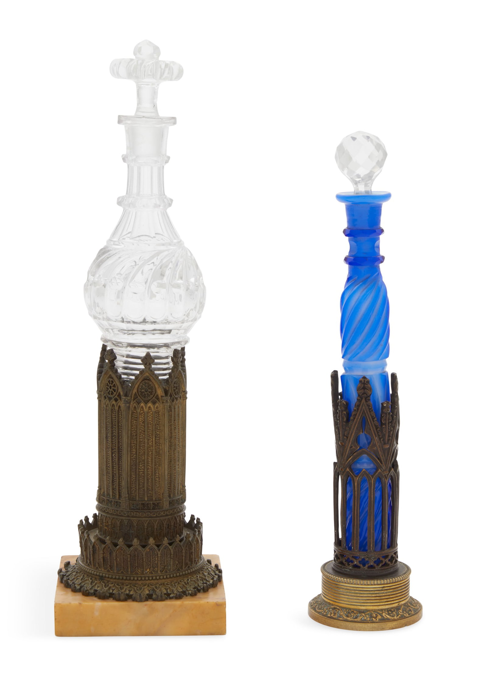 Bronze, Glass and Marble Perfume Bottles: Two William IV Bronze, Glass and Marble Perfume Bottles 19th century, the taller example with a colorless glass bottle with comet-patterned cutting, set into a Gothic Revival patinated bronze holder