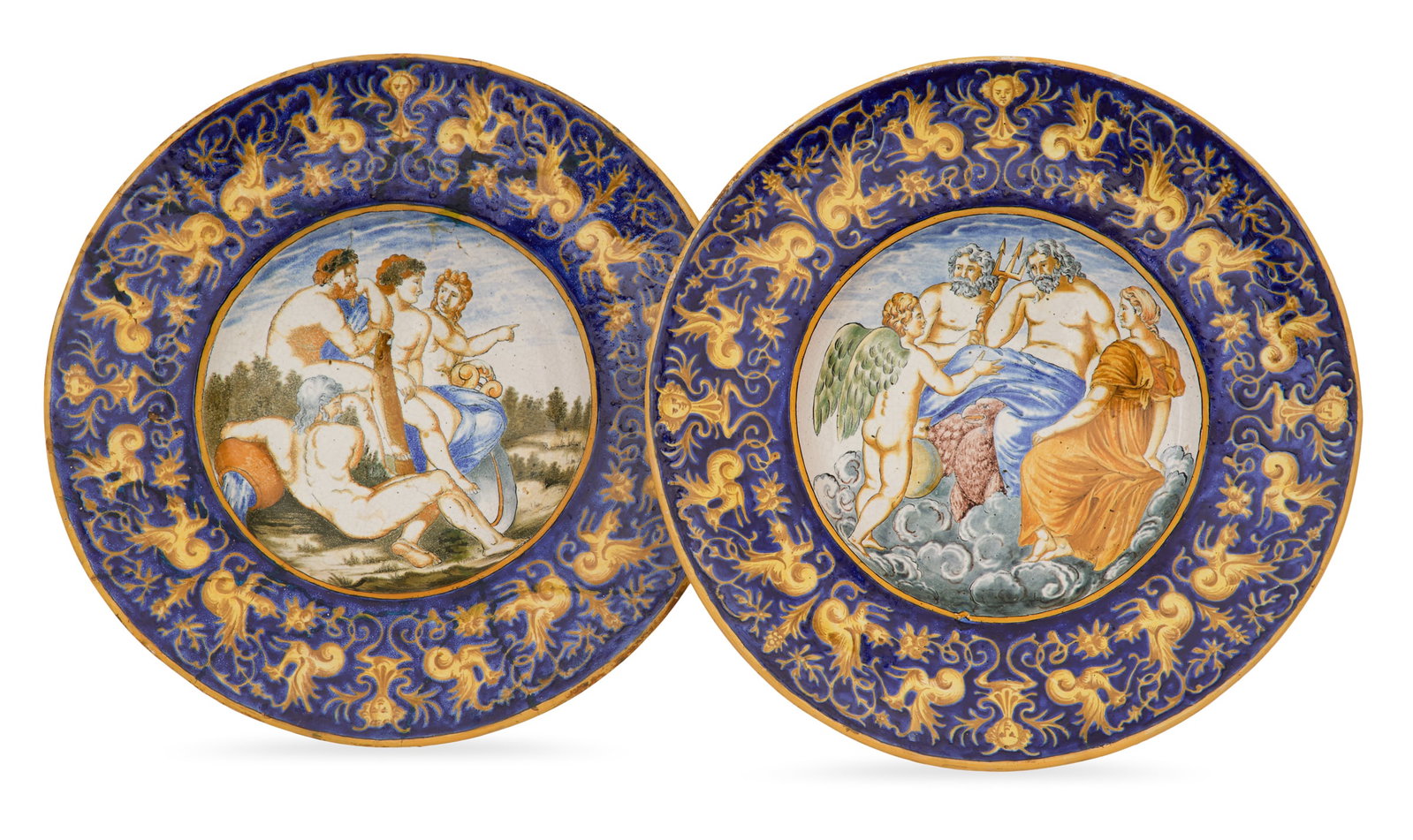 Pair of Italian Pottery Chargers: Pair of Italian Pottery Chargers in the Majolica Taste late 19th century, with depressed center sections, one decorated with Neptune and the other with Poseidon, each with a cobalt border decorated wi