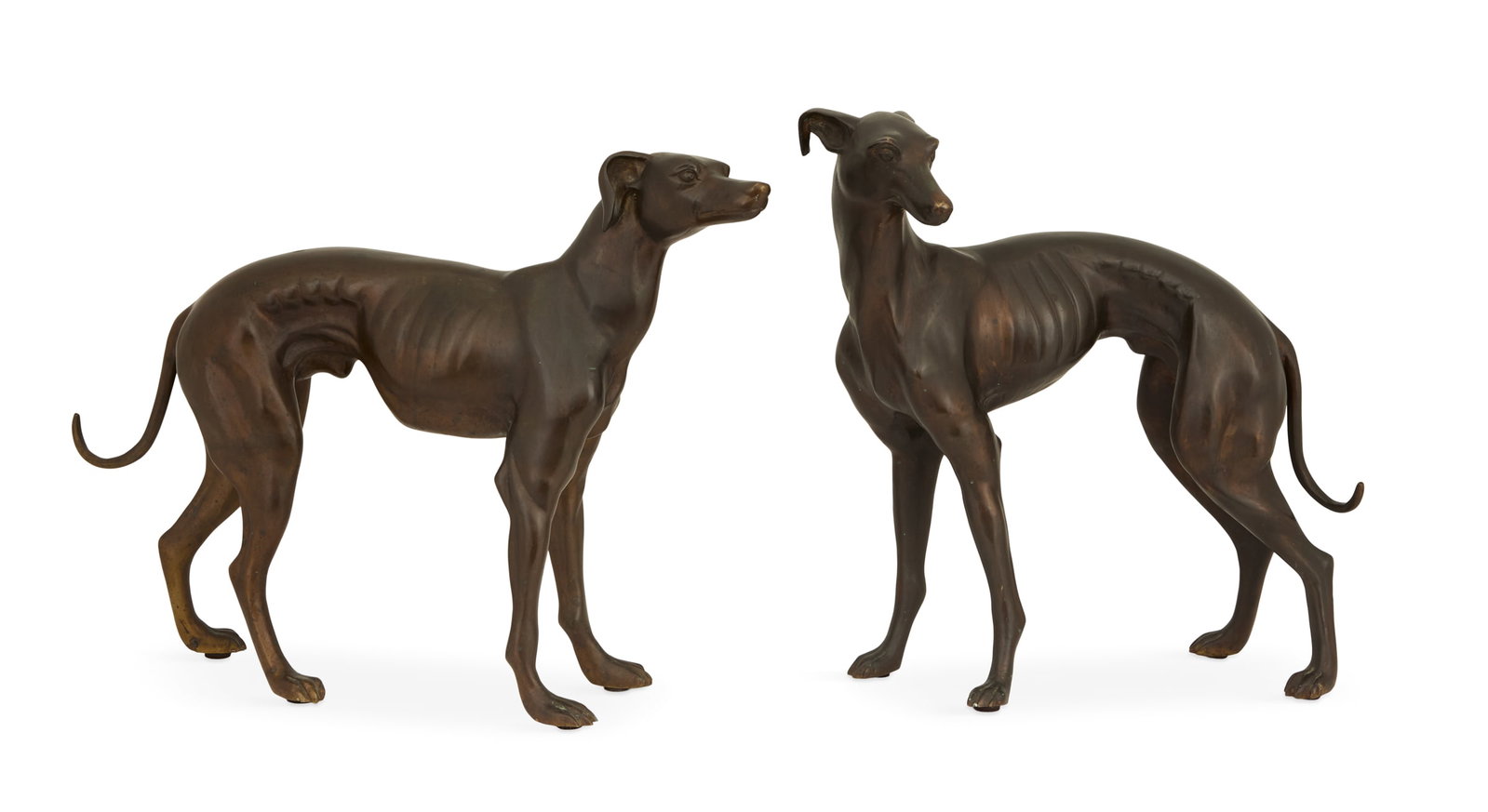 Pair of Patinated-Bronze Whippets: Pair of Patinated-Bronze Whippets first half 20th century, likely French, each standing, retaining a rich brown-patinated surface. h. 21" to 22-1/4", w. 21-1/4" to 27-1/4", d. 4-1/2" to 8-3/4"