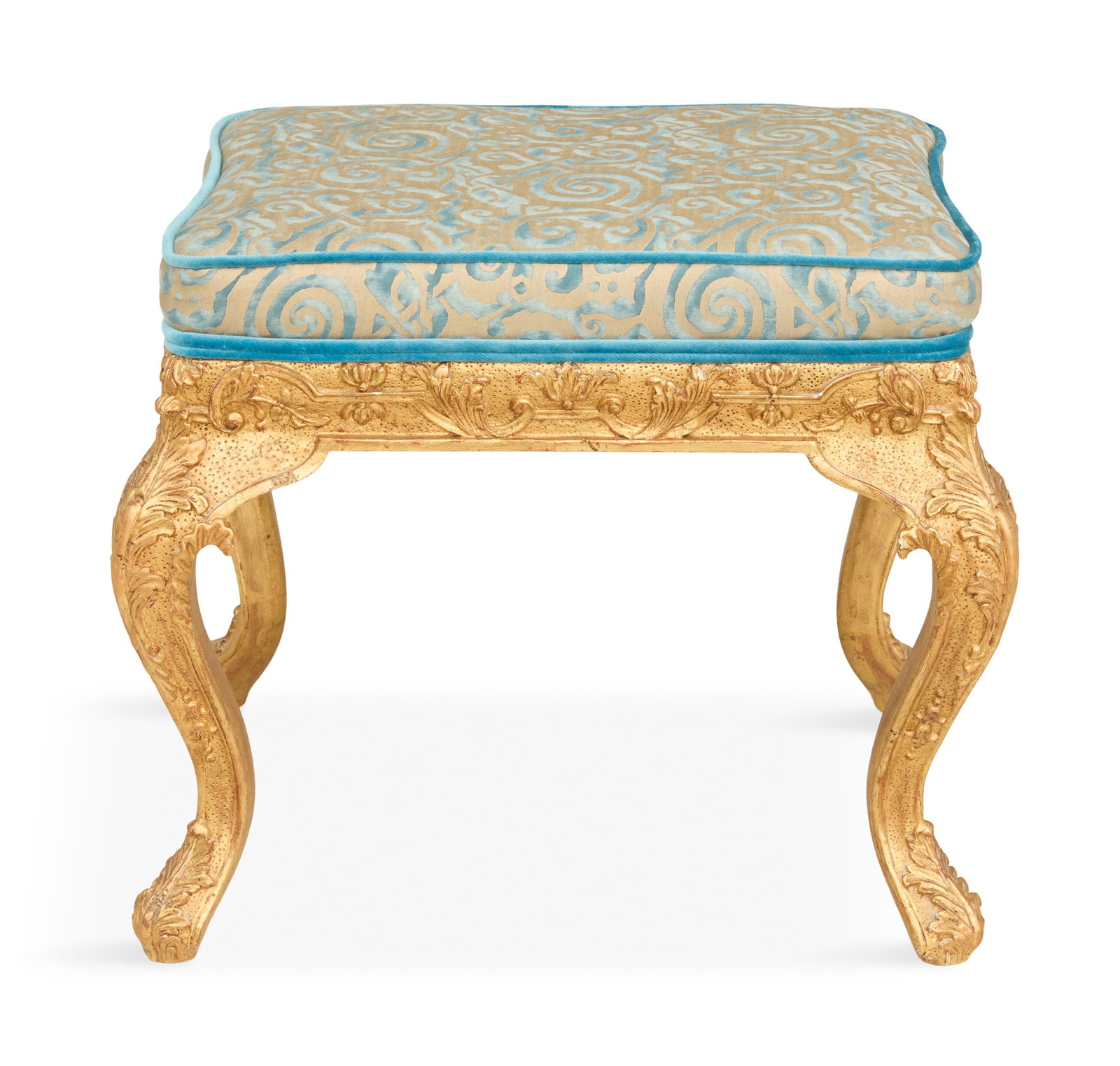 Regence-Style Giltwood Bench: Regence-Style Giltwood Bench 20th century, the padded seat covered in Fortuny fabric, on a carved frame and raised on cabriole legs. h. 18", w. 22", d. 17"