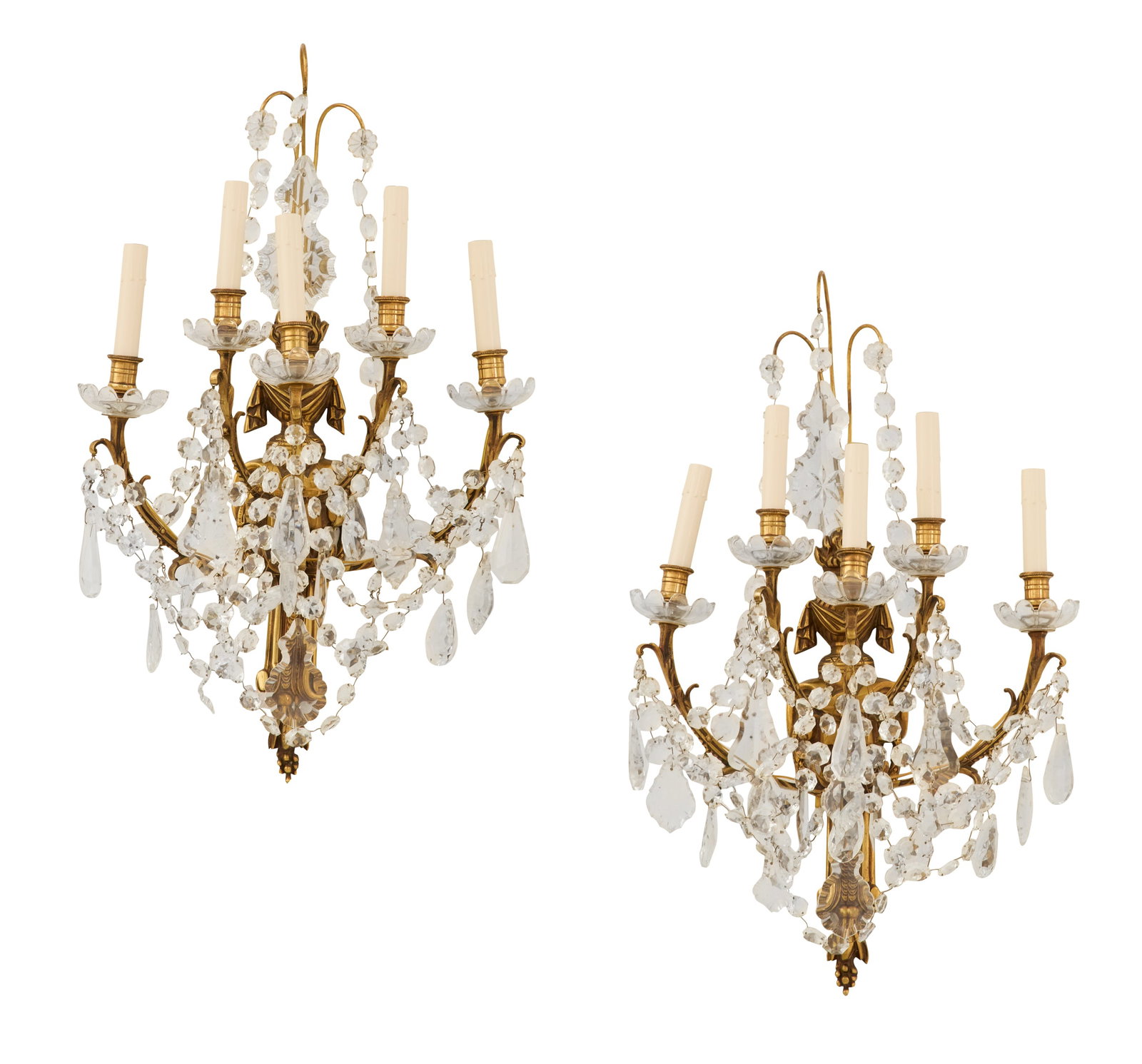 Pair of French Bronze and Crystal Sconces: Pair of French Bronze and Crystal Sconces mid-20th century, possibly Baccarat, the scrolled backplates set with flame finials and sprays of swags of crystal drops, the scrolled, leaf-molded candle bra
