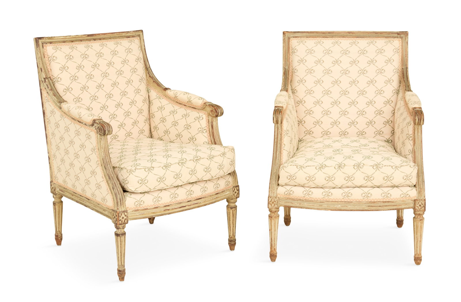 Pair of Louis XVI Polychrome Bergeres: Pair of Louis XVI Polychrome Bergeres 18th century, each with a padded back and arms and reversible seat cushion, with carved and molded frames, raised on turned and fluted legs ending in toupie