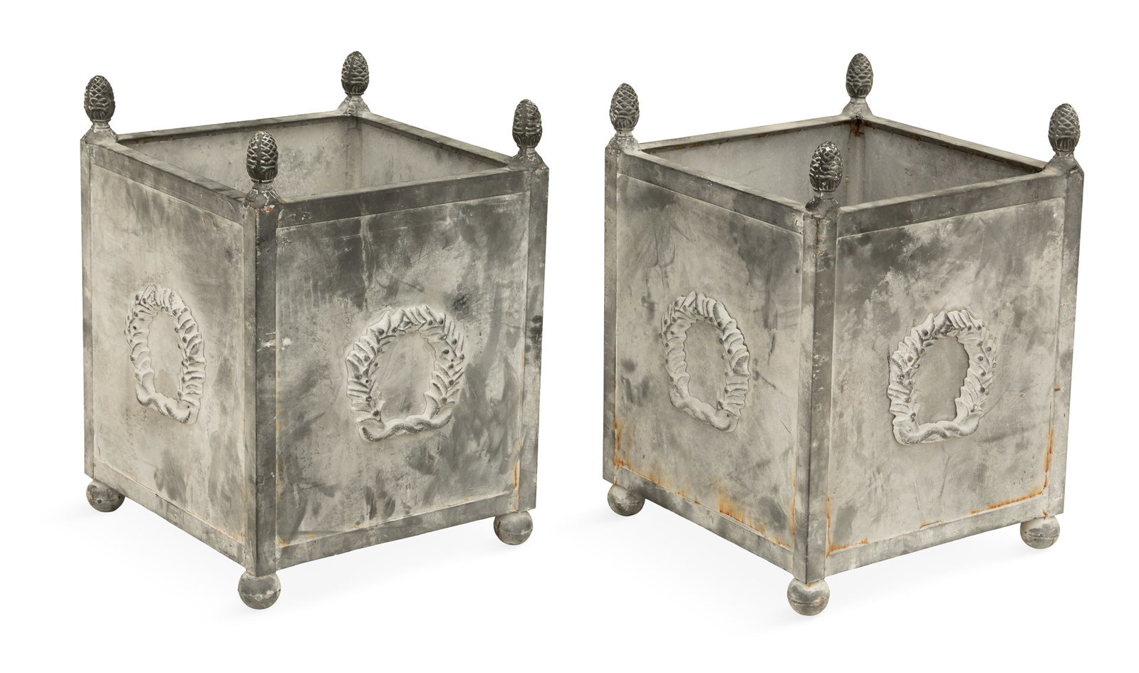 Pair of Painted Metal Tree Tubs: Pair of Painted Metal Tree Tubs the square tree tubs decorated with wreath mounts and raised on bun feet, with cone-form corner finials, the interiors with drainage holes. h. 22-1/2", w. 16-1/2", d. 1