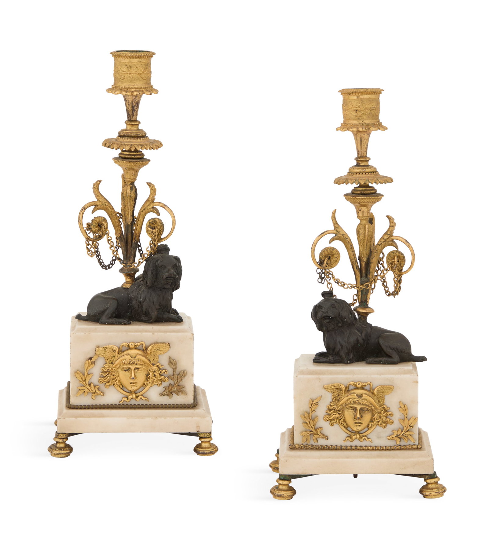 Bronze Dore et Patine and Marble Candlesticks: Pair of Handsome Regency Bronze Dore et Patine and Marble Candlesticks first quarter 19th century, the candle sockets molded with tendrils of laurel leaves, on standards decorated with chain-hung arab