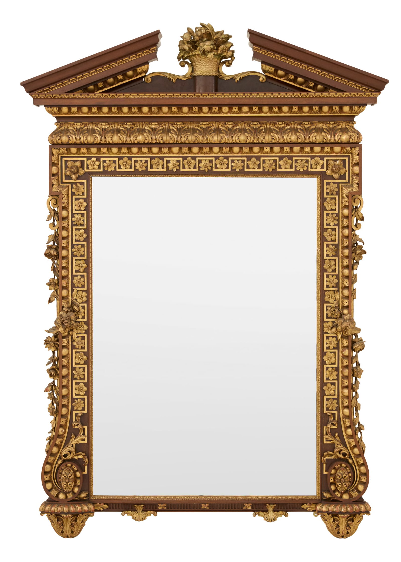 Edwardian Parcel-Gilt Mirror: Edwardian Parcel-Gilt Mirror in the George II Taste ca. 1900, the broken pediment trimmed with giltwood egg-and-dart molding, framing a giltwood basket-of-flowers finial, with crossetted upper corners