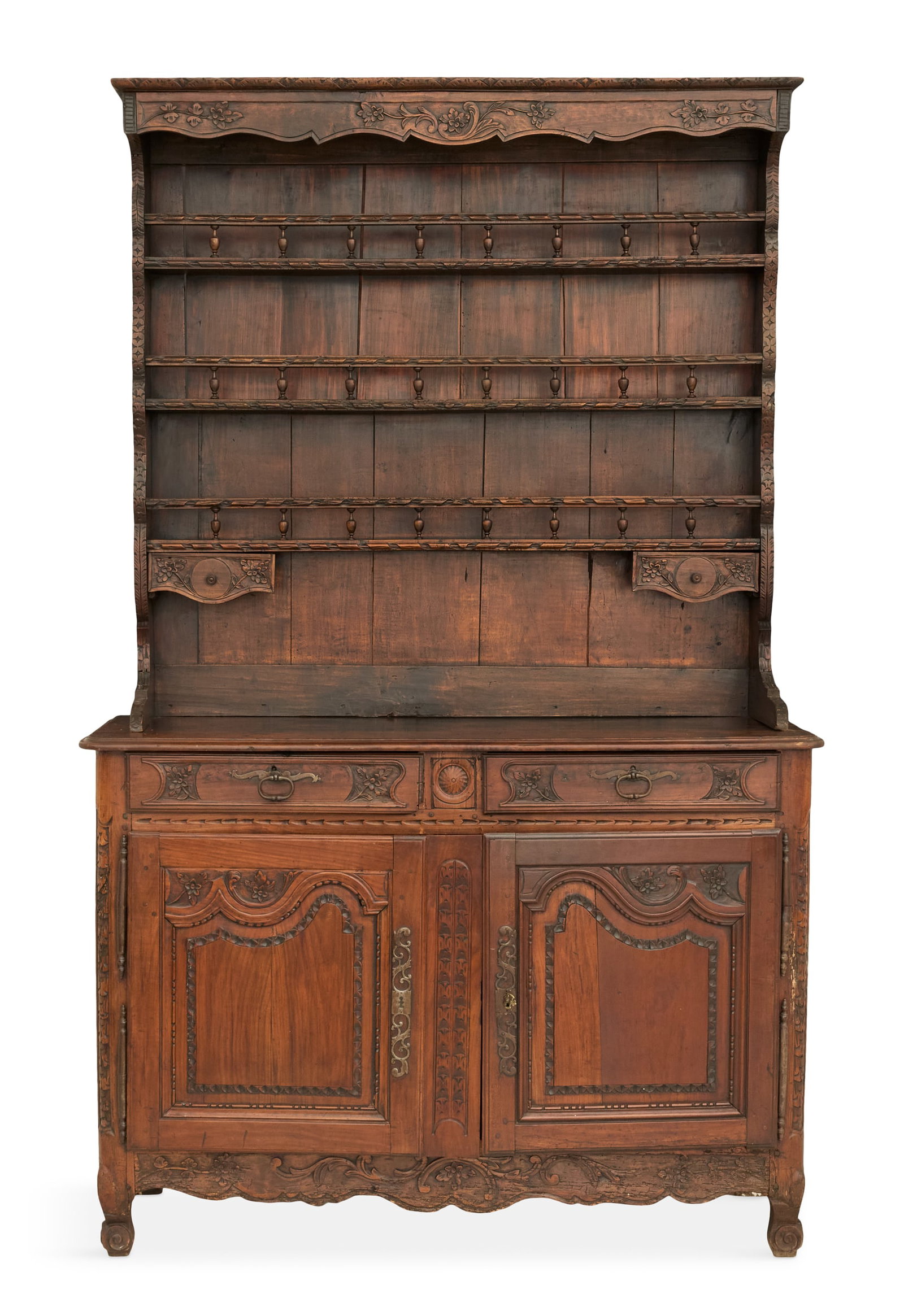 French Provincial Fruitwood Hutch: French Provincial Fruitwood Hutch 18th century, in two parts, the upper section with a carved and scalloped valance over three shelves with plate rails, the base with a pair of drawers over a pair of 