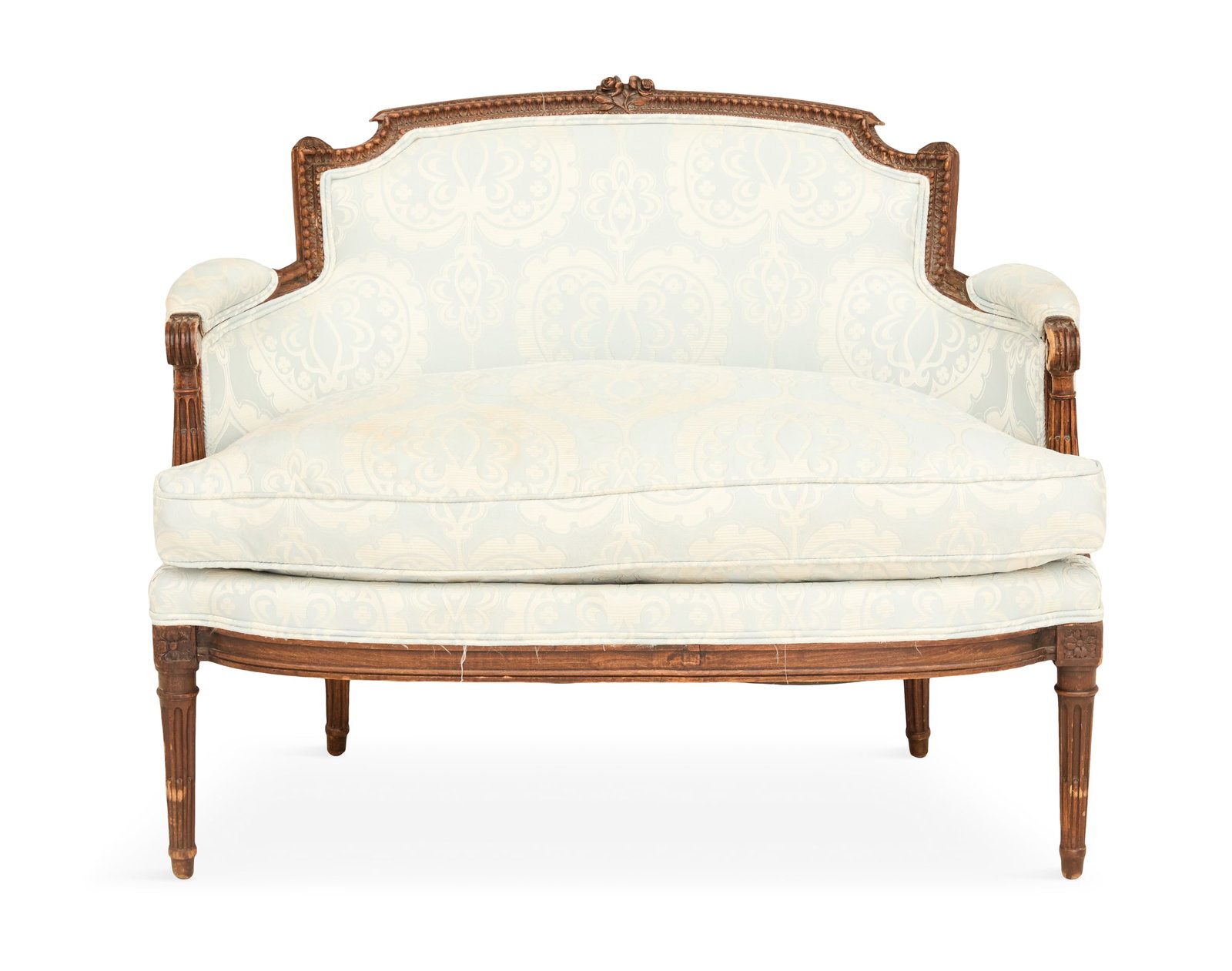 Petite French Walnut Settee: Petite French Walnut Settee 19th century, in the Louis XVI taste, the carved frame with a pair of roses centered along the back rail, the scrolled hand grips supported by stop-fluted posts, with a loo