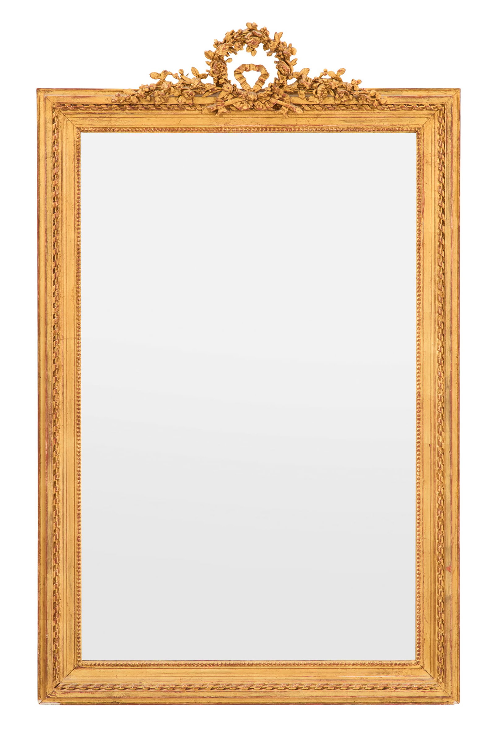 French Giltwood Mirror of Louis XVI Inspiration: French Giltwood Mirror of Louis XVI Inspiration ca. 1900, the foliate wreath crest bound with a bowknot and decorated with sprays of flowers on each side, the giltwood surround carved with a running r