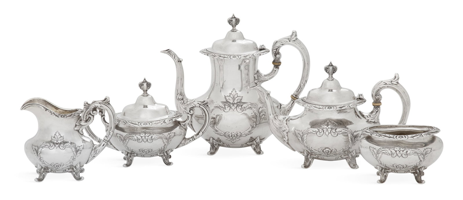 Reed & Barton "Burgundy" Sterling Silver Tea Set: Reed & Barton "Burgundy" Sterling Silver Tea Set the pattern introduced in 1949, Taunton, Massachusetts, including: a coffeepot, h. 9", l. 10-1/4"; a teapot, h. 6-1/2", l. 10-1/2"; a covered sugar bow