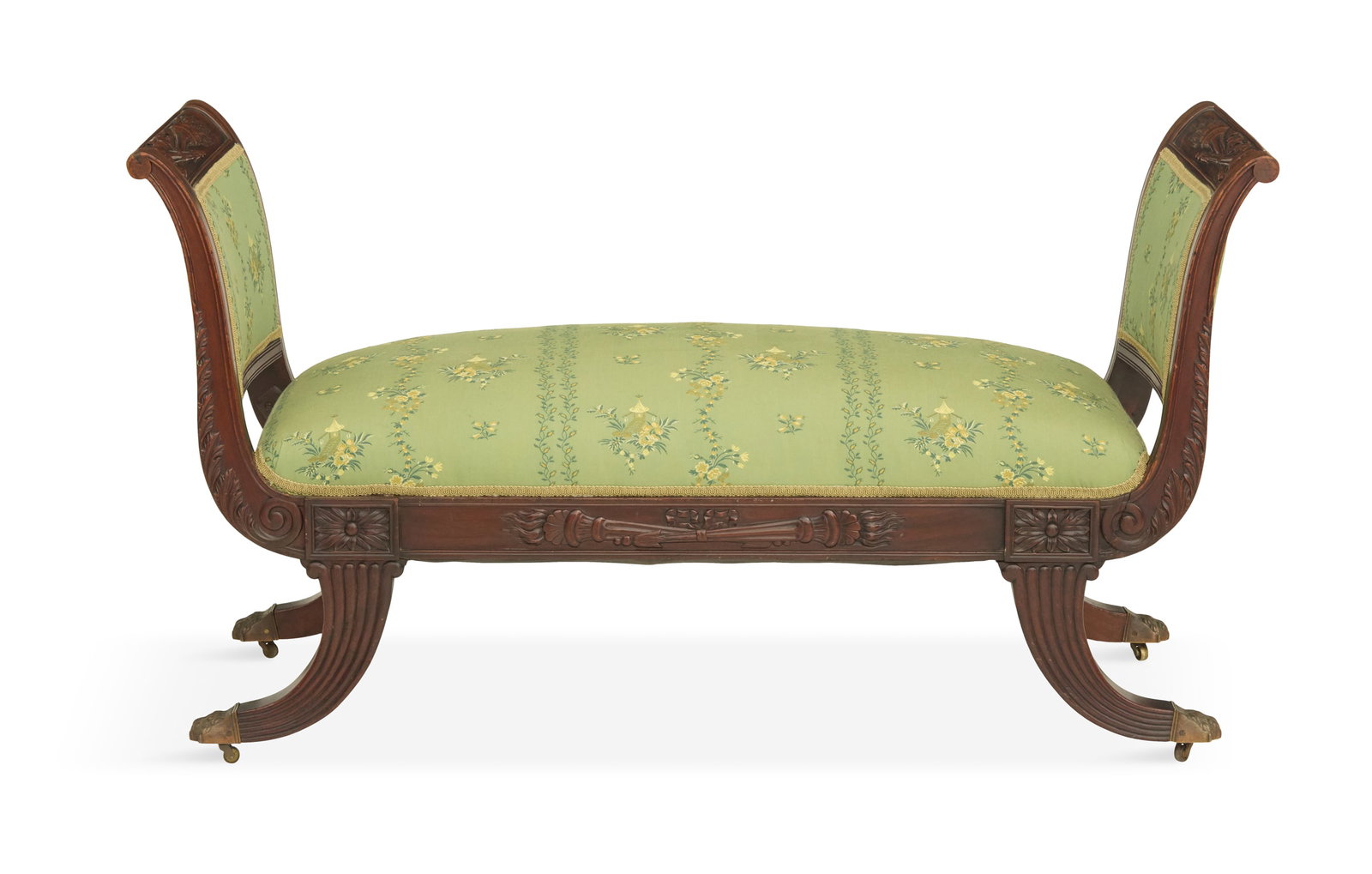 American Classical Mahogany Window Seat: American Classical Mahogany Window Seat first quarter 19th century, school of Duncan Phyfe, New York, with a padded seat and ends, the crest rails and front seat apron with carved and crossed flaming 