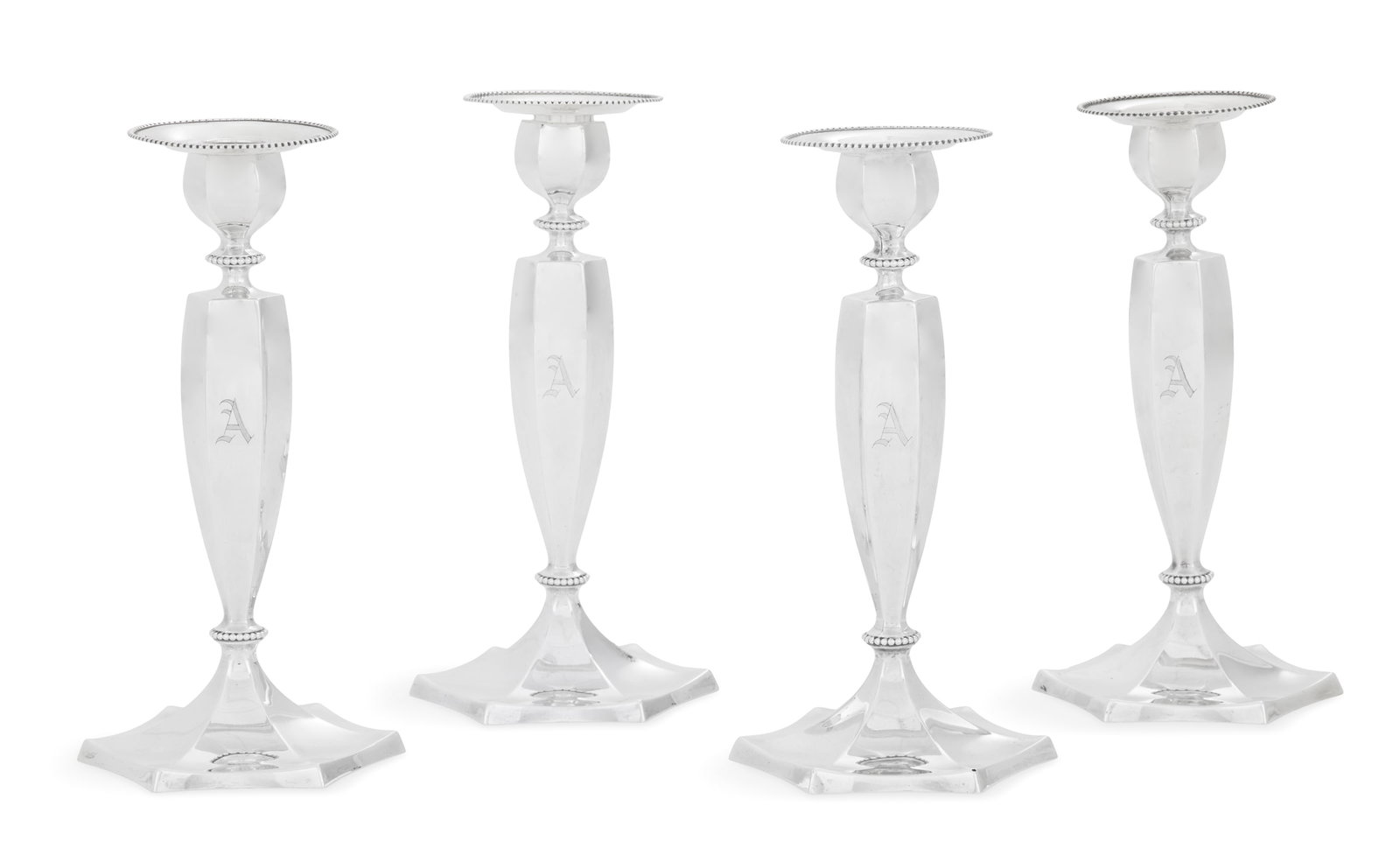 Set of Four American Sterling Silver Candlesticks: Set of Four American Sterling Silver Candlesticks 1940, Dominick & Haff, New York, New York, each with a fluted hexagonal standard above a domed foot and surmounted by a candle nozzle both en suite,