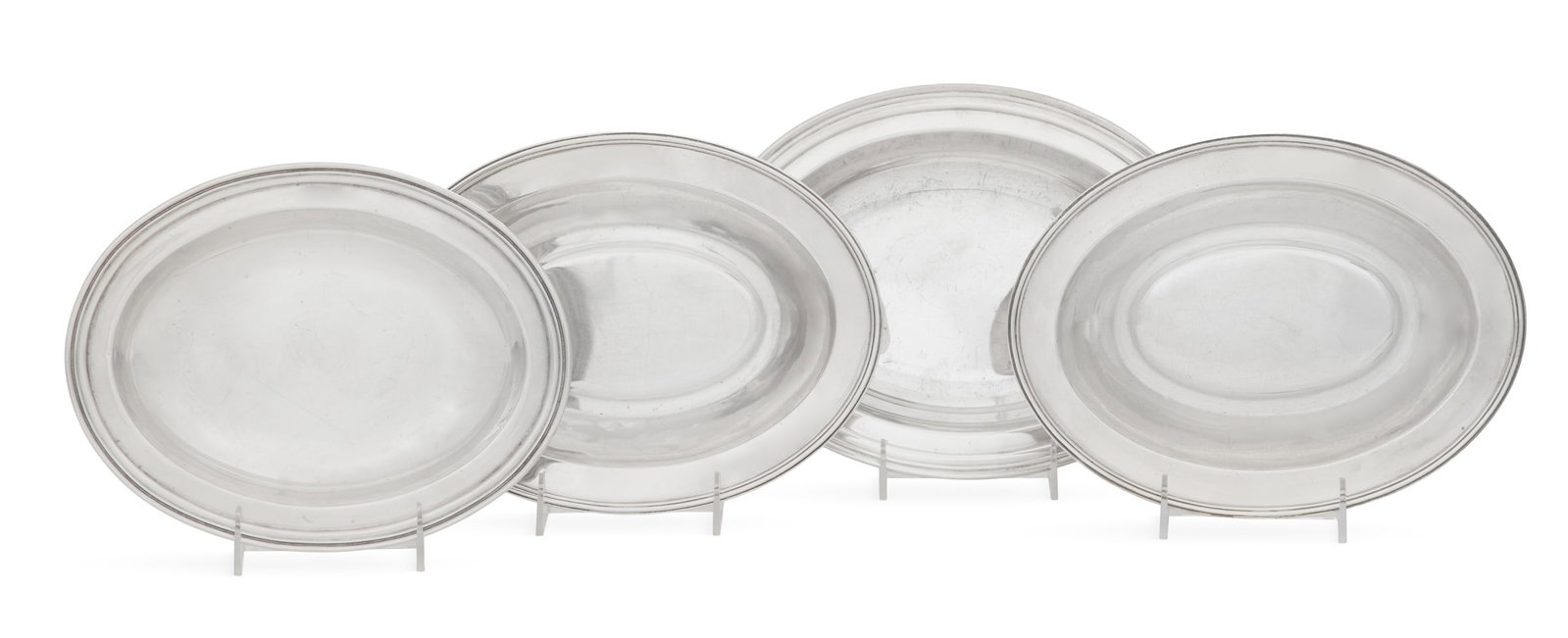 Four American Sterling Silver Vegetable Dishes: Four American Sterling Silver Vegetable Dishes mid-20th century, oval with molded rim, including one by International Sterling, 11-1/4" x 8-5/8", one by Weidlich Bros., 10-1/4" x 8", and a pair by