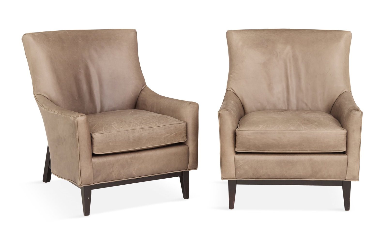 Pair of Mid-Century Modern Leather Lounge Chairs: Pair of Mid-Century Modern Leather Lounge Chairs second half 20th century, each with a slightly curved back and loose seat cushion, raised on ebonized wooden legs and back frame. h. 35-1/2", seat h. 1