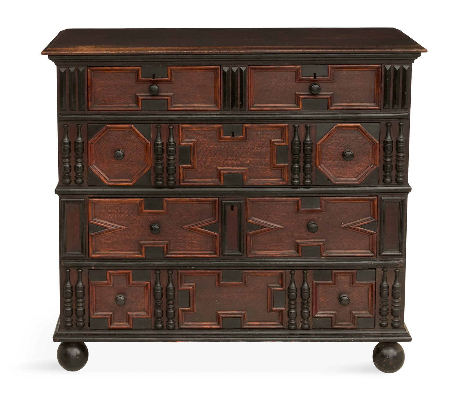 Centennial Oak Chest in the Pilgrim Taste: Centennial Oak Chest in the Pilgrim Taste late 19th/early 20th century, the drawers with applied ebonized half spindles, hexagonal panels and crossetted panels in the "Hadley" manner, raised on ball f