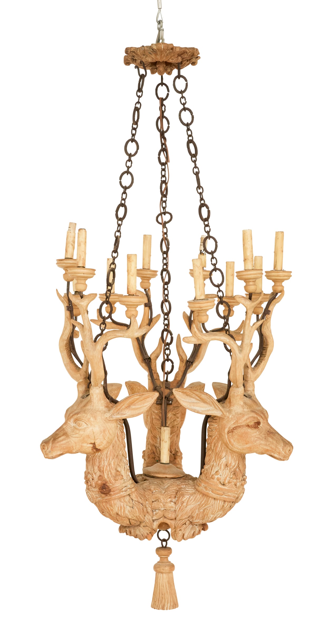 Stag-Carved Wooden and Patinated-Metal Chandelier: Stag-Carved Wooden and Patinated-Metal Chandelier 20th century, the thirteen-light chandelier with three carved deer heads forming the body, their antlers set with turned wooden candle supports, with 
