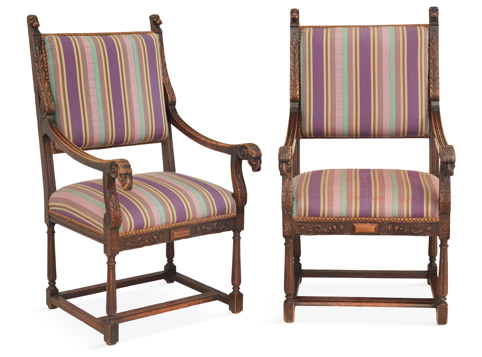 Pair of Continental Oak Fauteuils: Pair of Continental Oak Fauteuils 19th century, in the Renaissance taste, each with a padded back surmounted by lion-masque finials, joined by downswept arms on ram's-head hand rests to the padded sea