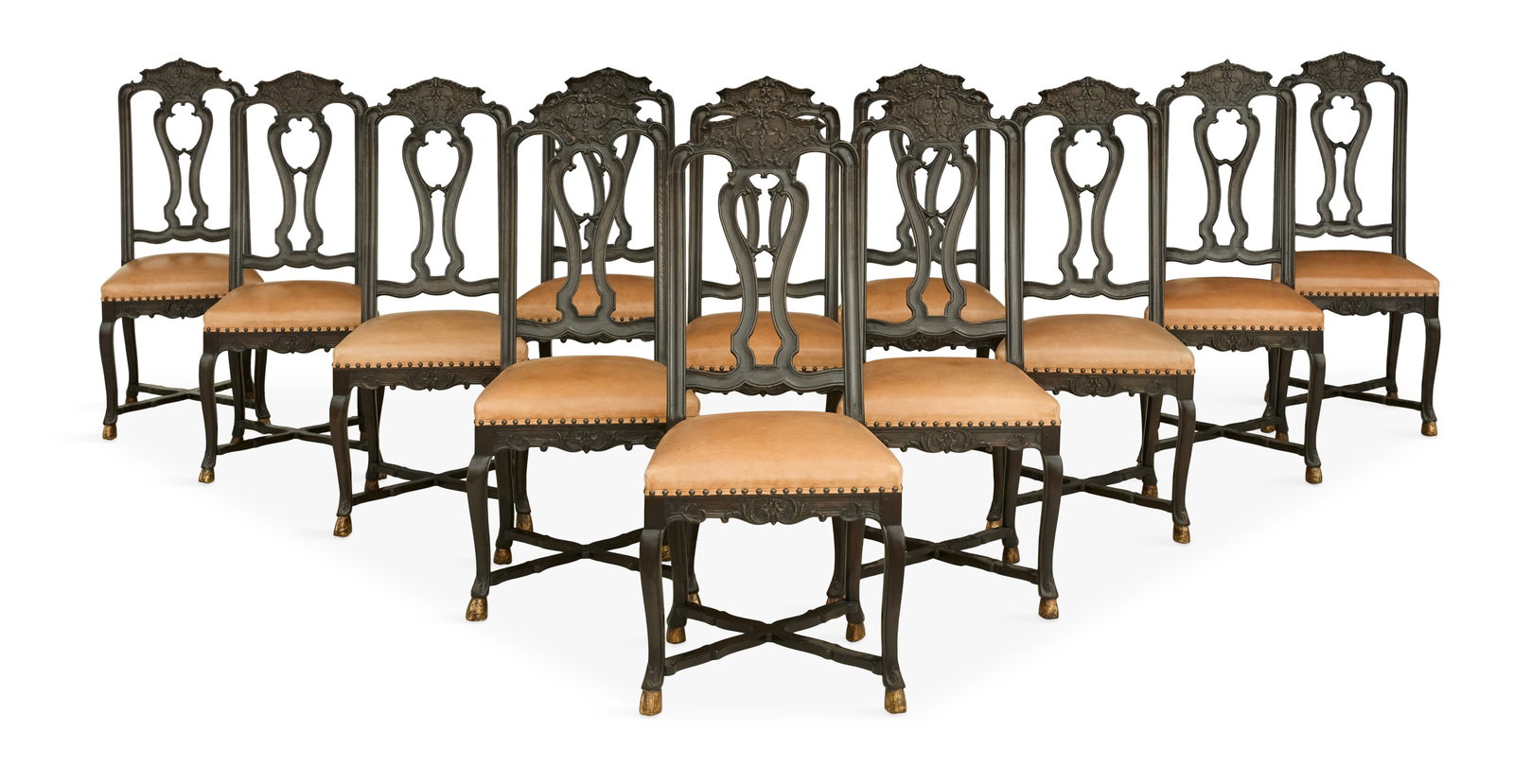 Suite of Twelve Carved Oak Dining Chairs: Suite of Twelve Carved Oak Dining Chairs 18th century, possibly Portuguese, each with a tall molded back frame and carved headrest, supported by a pierced splat, the seat covered in leather, raised on