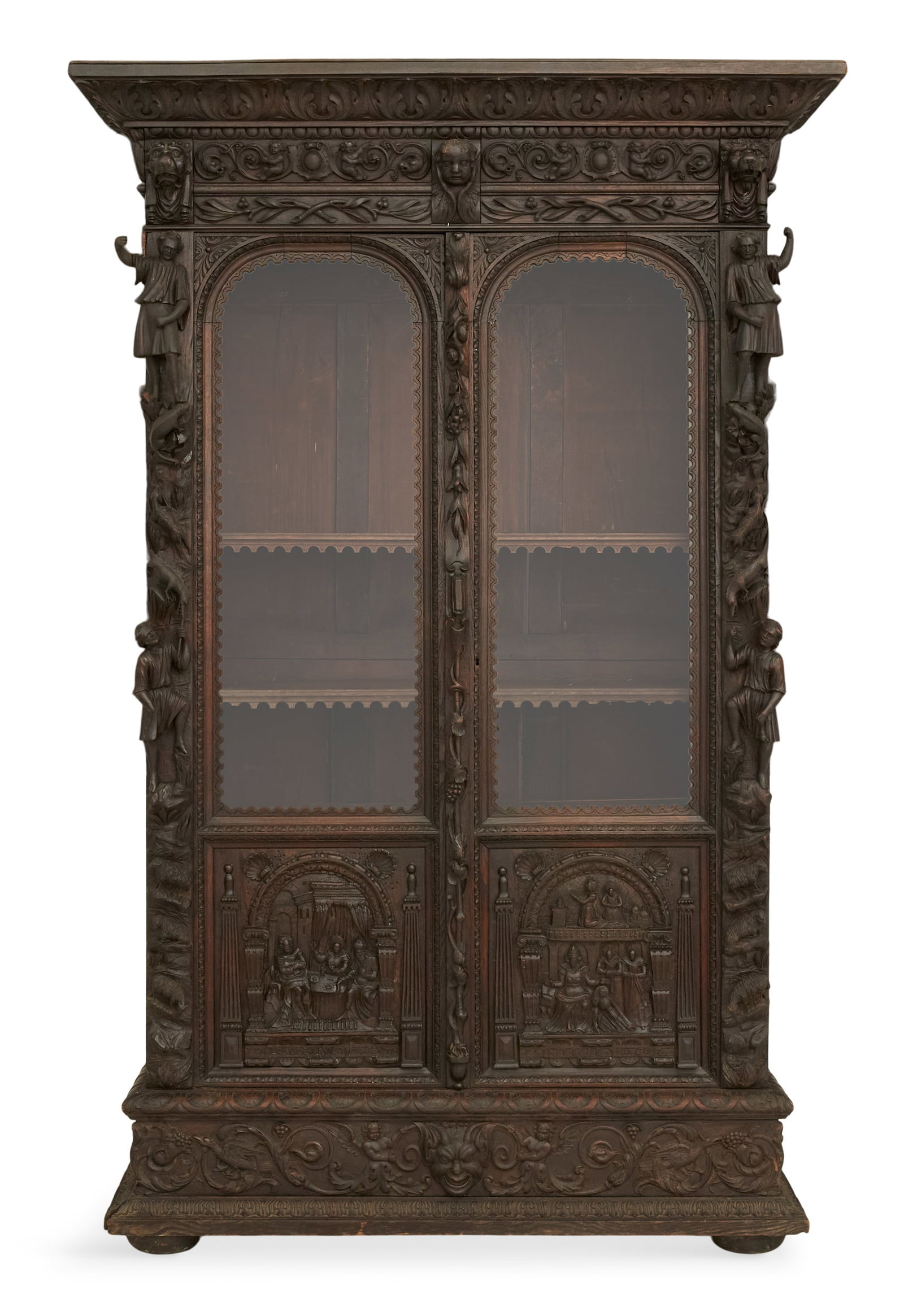 Continental Carved Oak Bookcase: Continental Carved Oak Bookcase 19th century, in the Renaissance taste, profusely carved with a pair of arched doors, flanked by columns with allegorical scenes of figures and animals, the base fitted