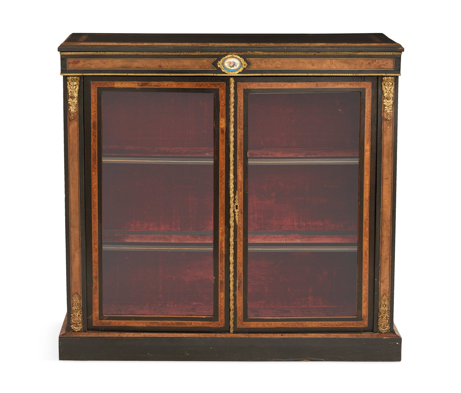 Napoleon III Ebonized Cabinet: Napoleon III Ebonized Cabinet third quarter 19th century, the double burl-banded rectangular top above a case fitted with a frieze centered by a floral "Sevres"-style plaque over two glazed cupboard d