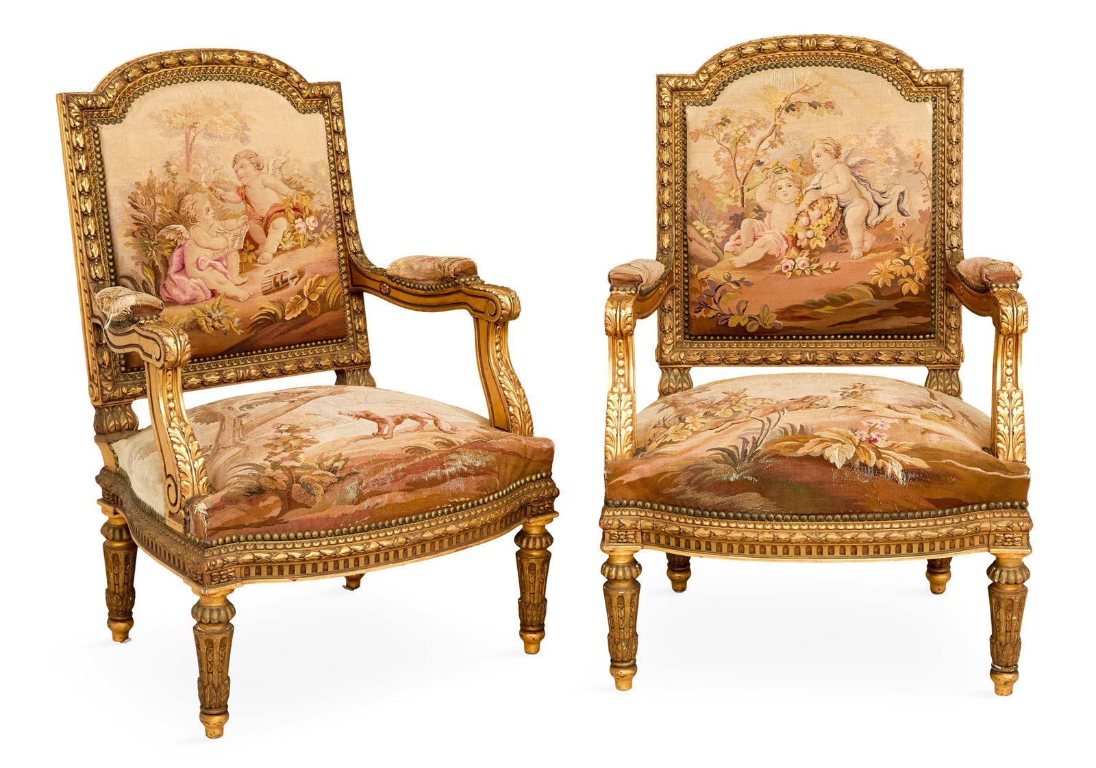 Pair of Napoleon III Giltwood Fauteuils: Pair of Napoleon III Giltwood Fauteuils 19th century, in the Louis XVI taste, each with a domed and padded back within a molded, laurel-carved frame, joined by acanthine-carved, padded arms to the lik