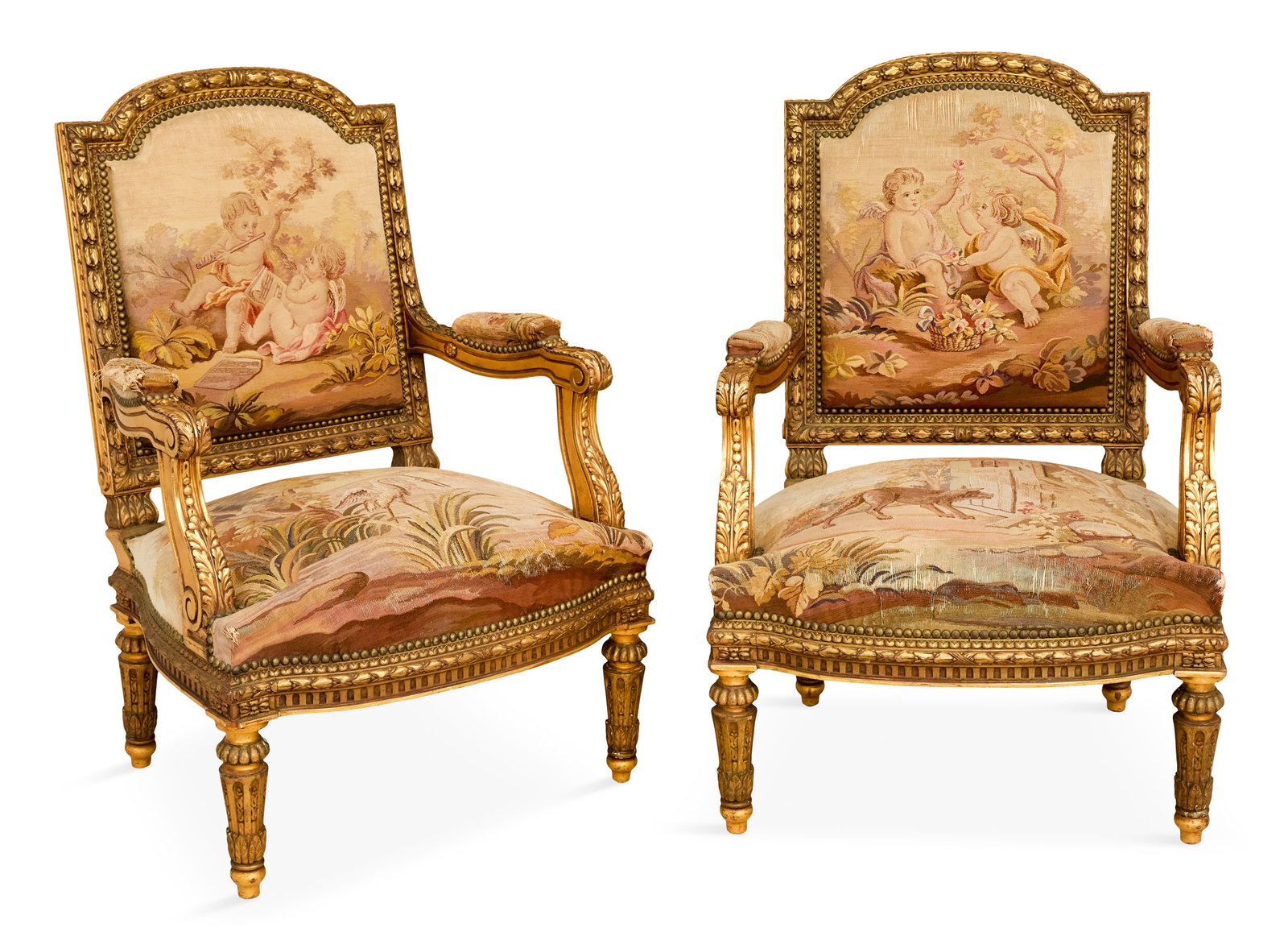 Pair of Napoleon III Giltwood Fauteuils: Pair of Napoleon III Giltwood Fauteuils 19th century, in the Louis XVI taste, each with a domed and padded back within a molded, laurel-carved frame, joined by acanthine-carved, padded arms to the lik