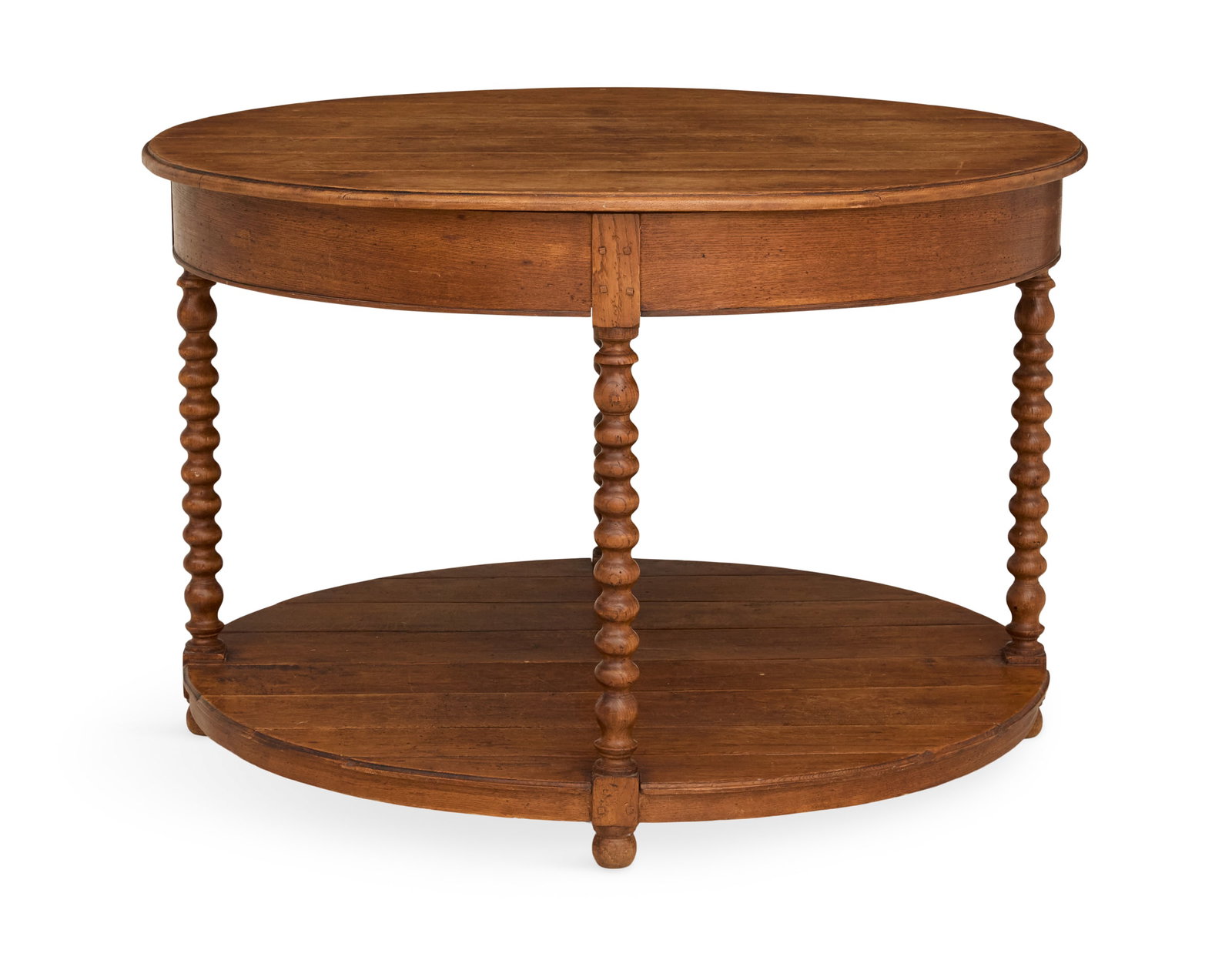 Provincial Oak Center Table: Provincial Oak Center Table 19th century, the circular top with a molded edge, above a conforming plain frieze, raised on four bobbin-turned legs joined by a ring stretcher and ending in bun feet. h. 