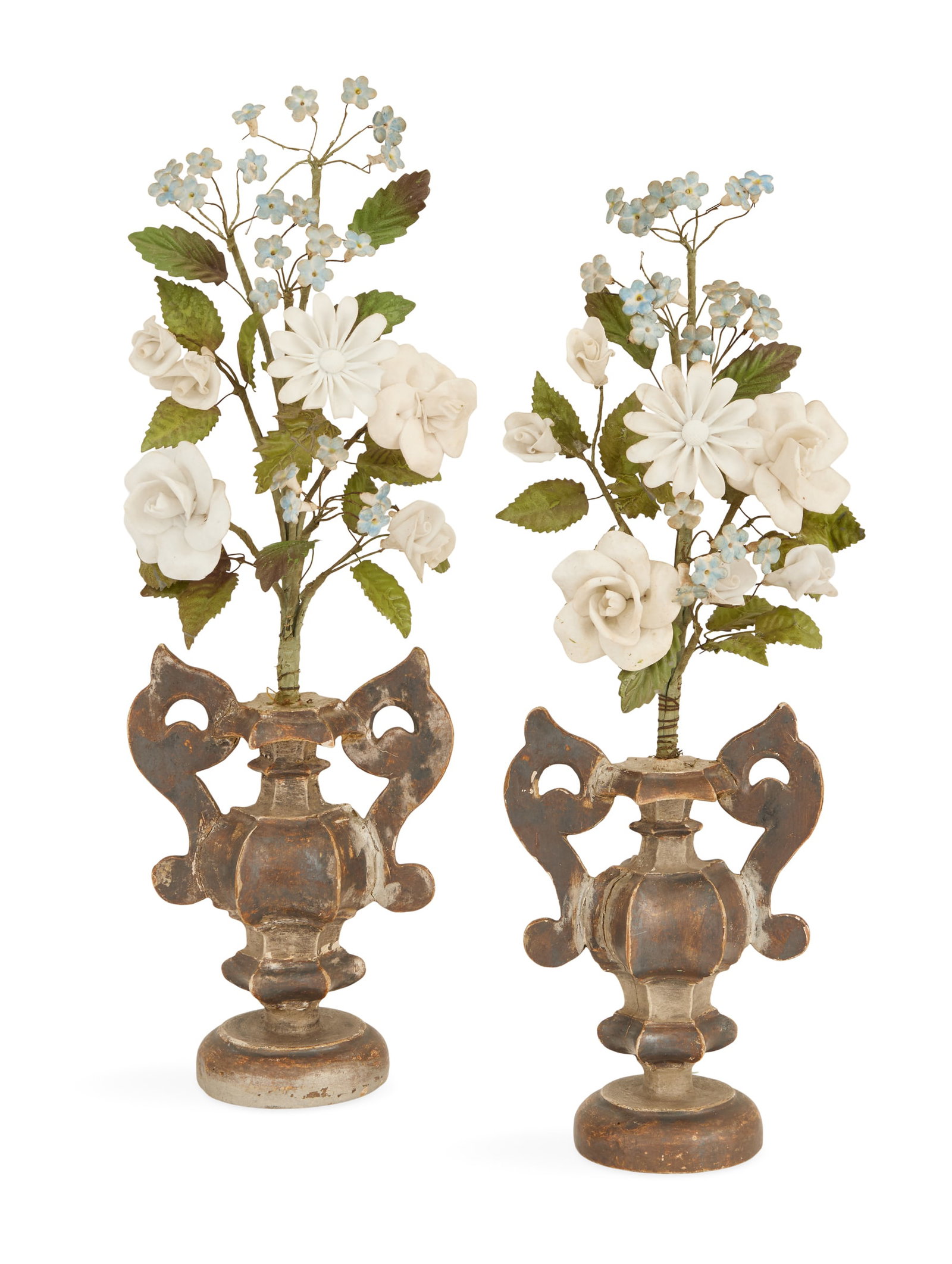 Pair of Italian Wooden Urns of Flowers: Pair of Italian Wooden Urns of Flowers early 20th century, the porcelain, wire and tole bouquets of flowers mounted in Baroque-style silver faceted giltwood urns mounted with scrolled handles. h. 19-1
