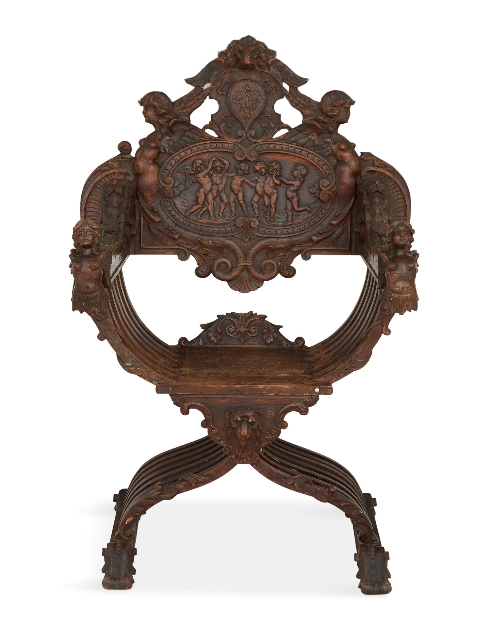 Italian Baroque-Style Walnut Savanarola Chair: Italian Baroque-Style Walnut Savanarola Chair 19th century, the elaborately carved back with winged angels, centered by a lion's masque, the arm fronts with carved maiden busts. h. 49", seat h. 19", w