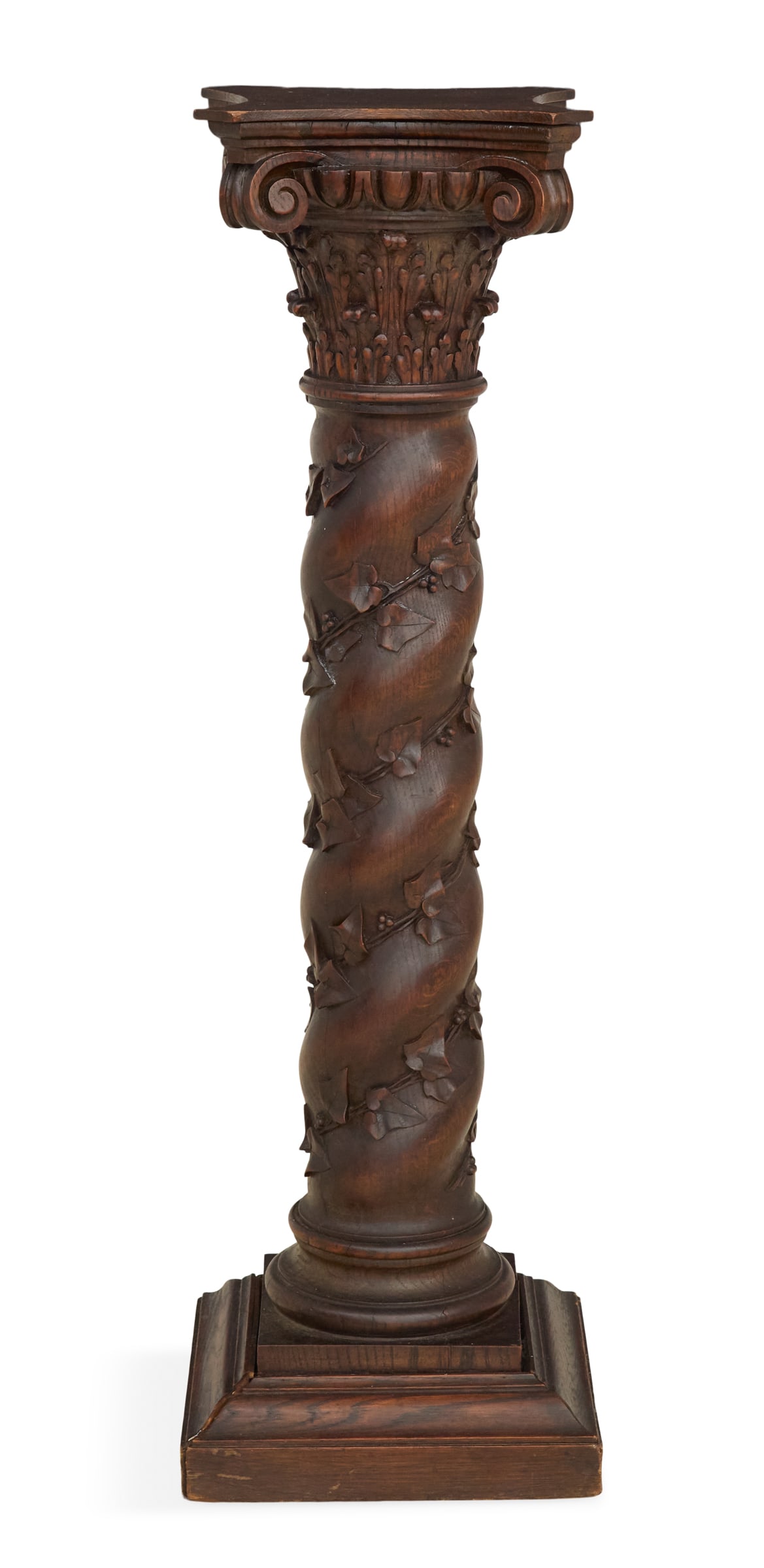 Baroque-Style Carved Oak Pedestal: Baroque-Style Carved Oak Pedestal early 20th century, the top with in-curved sides over a carved Corinthian-form capital, the spiral- and vine-carved standard mounted to a stepped and molded base. h. 