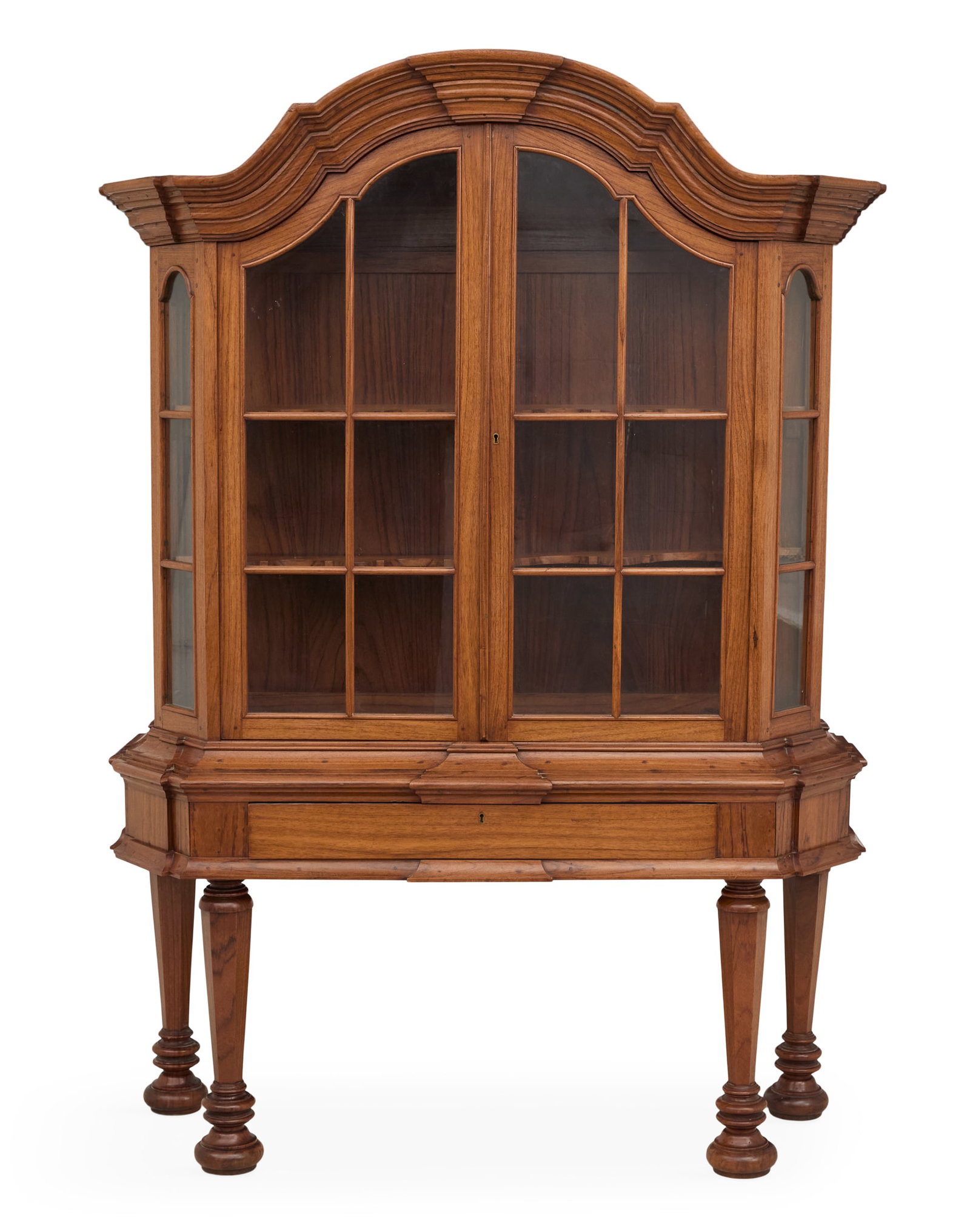 Dutch-Style Padouk Wood Vitrine: Dutch-Style Padouk Wood Vitrine ca. 1900, the top with a complex arched molding over a pair of six-light glazed doors, mounted to a base with tapered legs ending in large turned feet. h. 75", w. 54", 