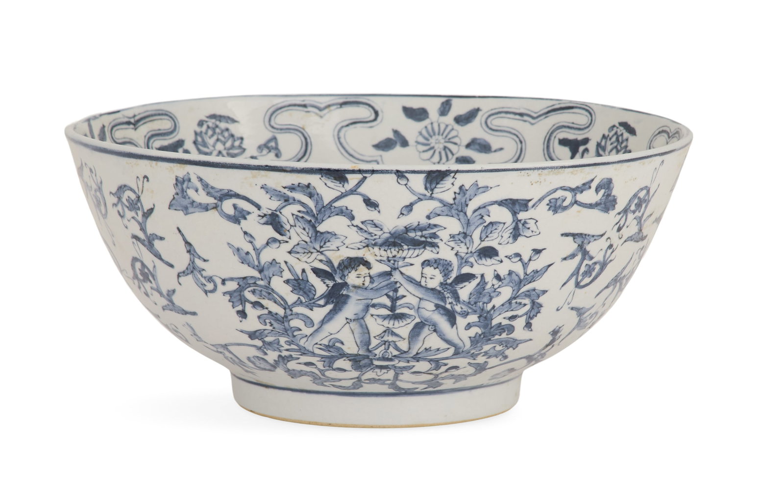 Chinese Export Porcelain Bowl: Chinese Export Porcelain Bowl in the 17th-Century Taste decorated with a pair of cherubs supporting a vase of flowers, framed in scrollwork and vines, the interior with lotus blossoms and leaves. h. 4