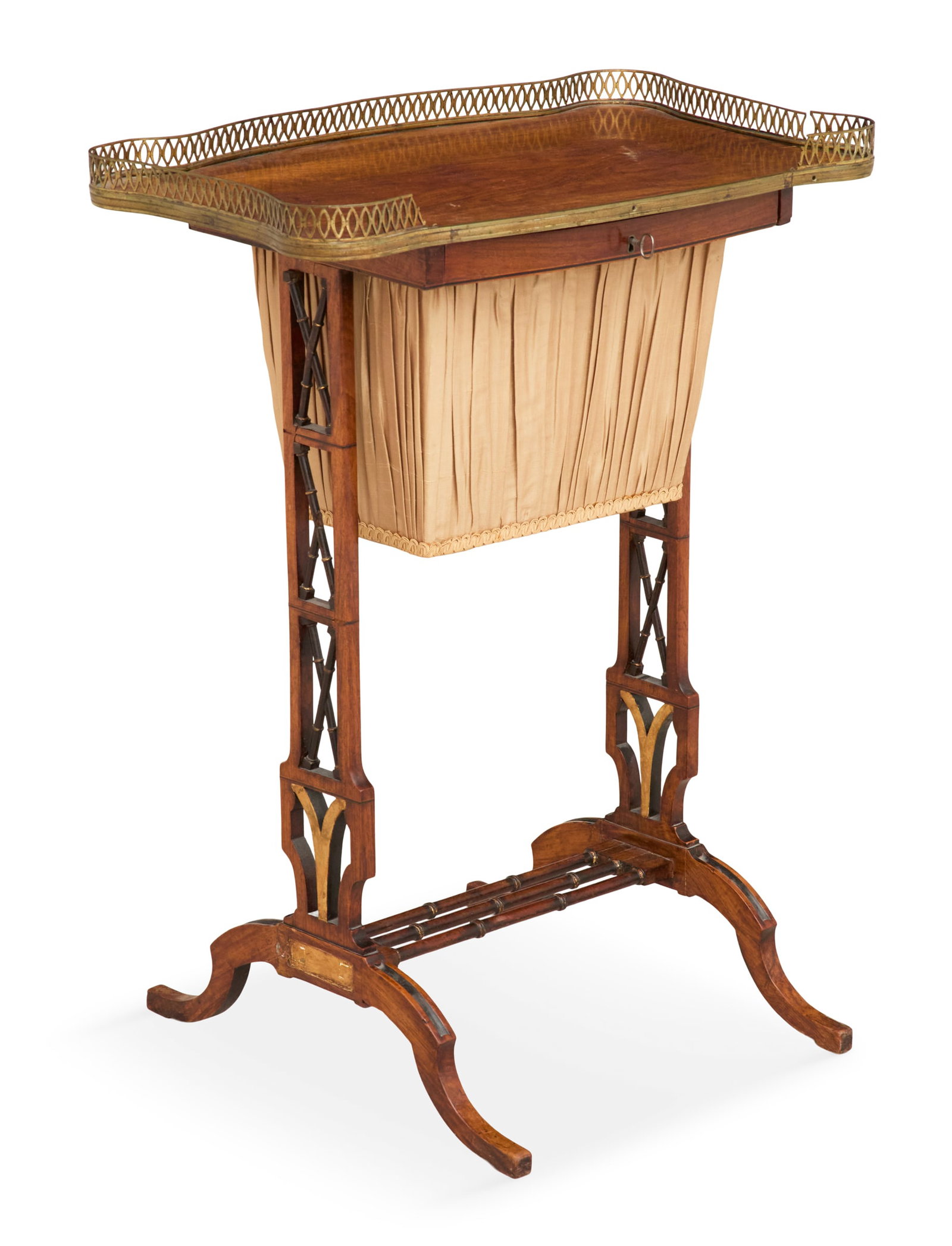 Petite Regency Rosewood Sewing Table: Petite Regency Rosewood Sewing Table 19th century, the shaped top with a three-quarter pierced bronze gallery above a pull-out fabric-covered storage basket, supported by trestle-form ends with faux b