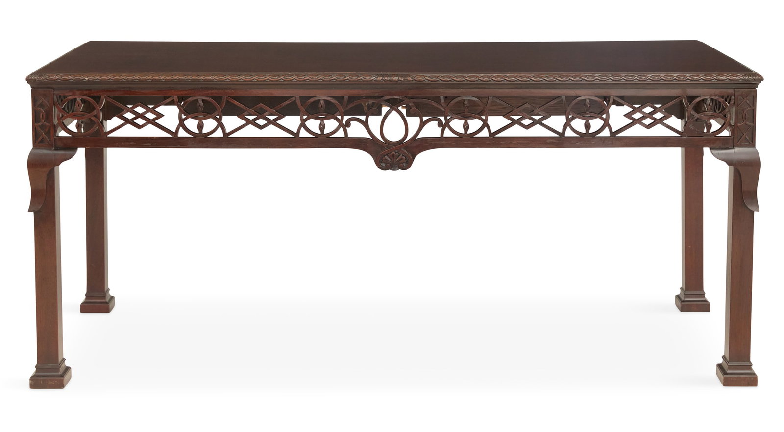 Labeled "Baker Furniture" Mahogany Writing Desk: Labeled "Baker Furniture" Mahogany Writing Desk the rectangular top with a carved, gadrooned edge, the front and side aprons with geometric open fretwork in the Chinese Chippendale taste, the back