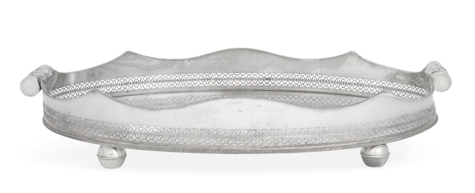 Large English Silverplate Tray: Large English Silverplate Tray first quarter 20th century, of oval form with pierced gallery below a serpentine-waved gadrooned rim, with acanthus-mounted baton handles and raised on four torus-banded