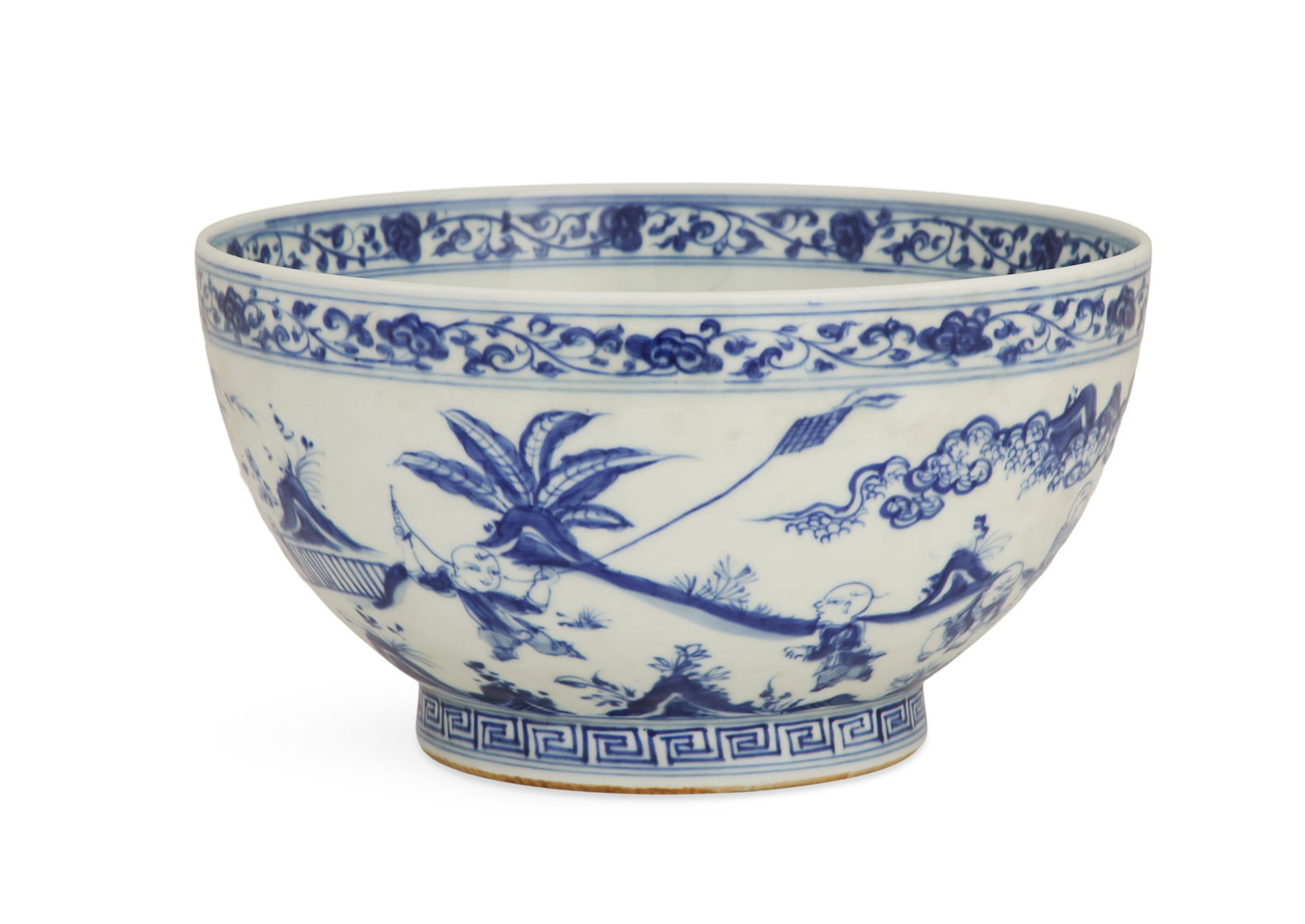 Chinese Blue-and-White Porcelain Punch Bowl: Chinese Export Blue-and-White Porcelain Punch Bowl 20th century, in the Ming taste, decorated with children flying kites, with a vine-decorated upper border and a fret-decorated foot, the bottom with 