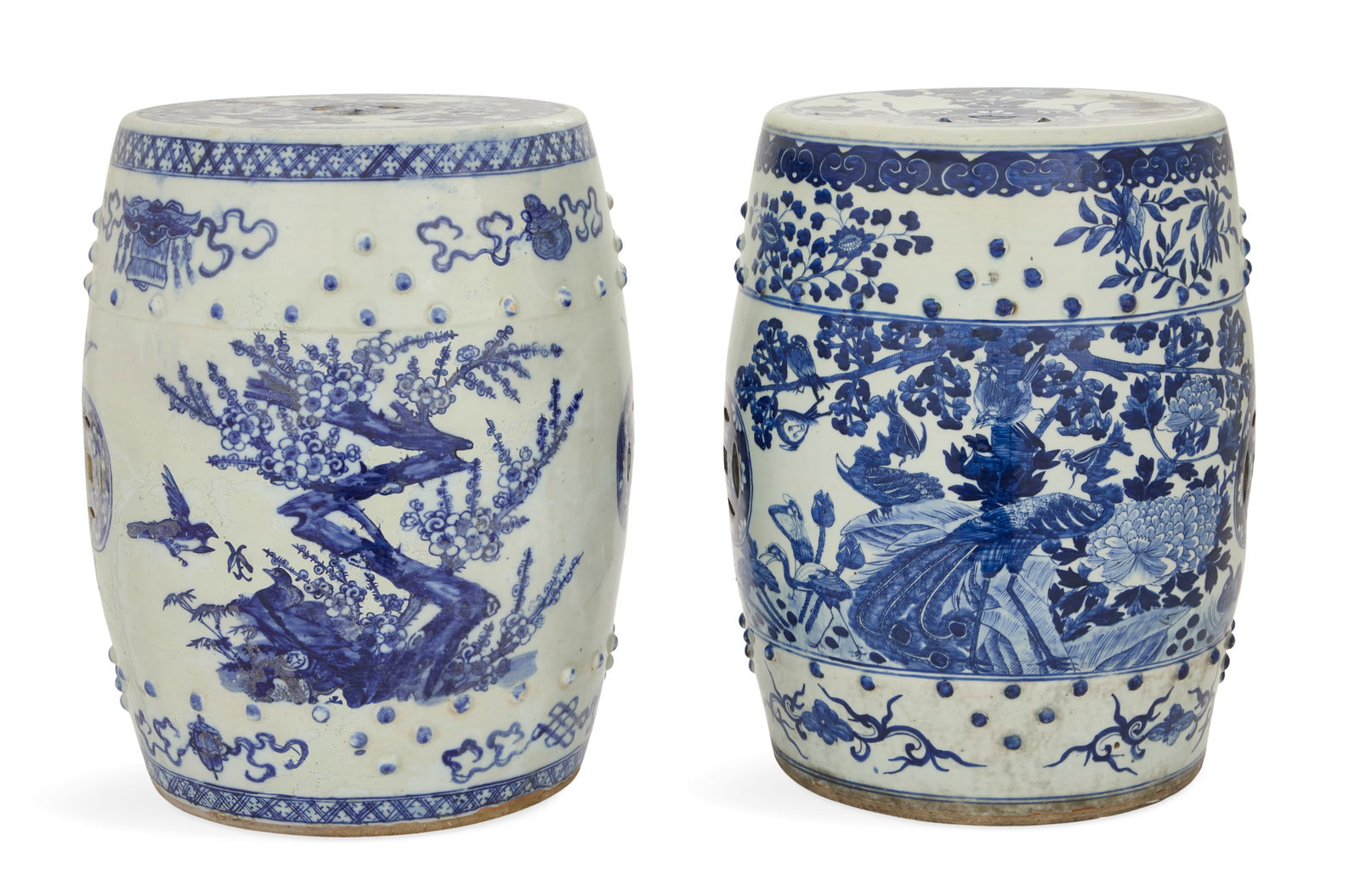 Near Pair of Chinese Export Garden Seats: Near Pair of Chinese Export Garden Seats 20th century, the blue-and-white seats framed with peonies, the sides decorated with pierced "coins", tree peonies and birds, and the tops with pierced "coins"