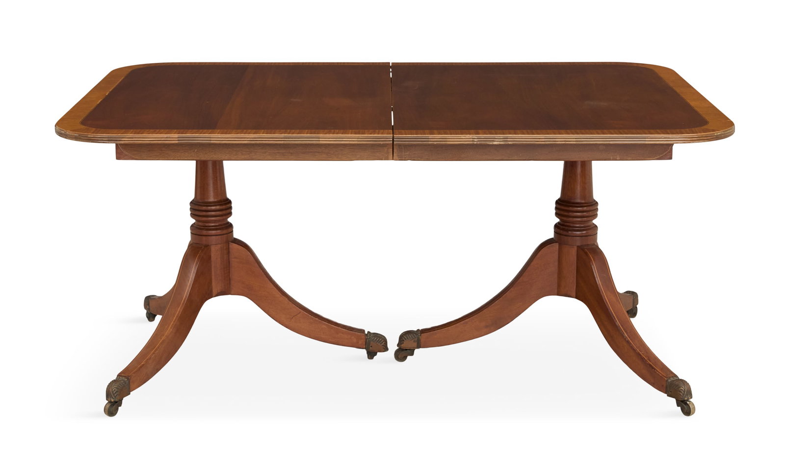 Regency-Style Satinwood-Banded Dining Table: Regency-Style Mahogany and Satinwood-Banded Dining Table 20th century, the rectangular top with a reeded edge and satinwood banding, mounted to a pair of turned pedestals, each with three string-inlai