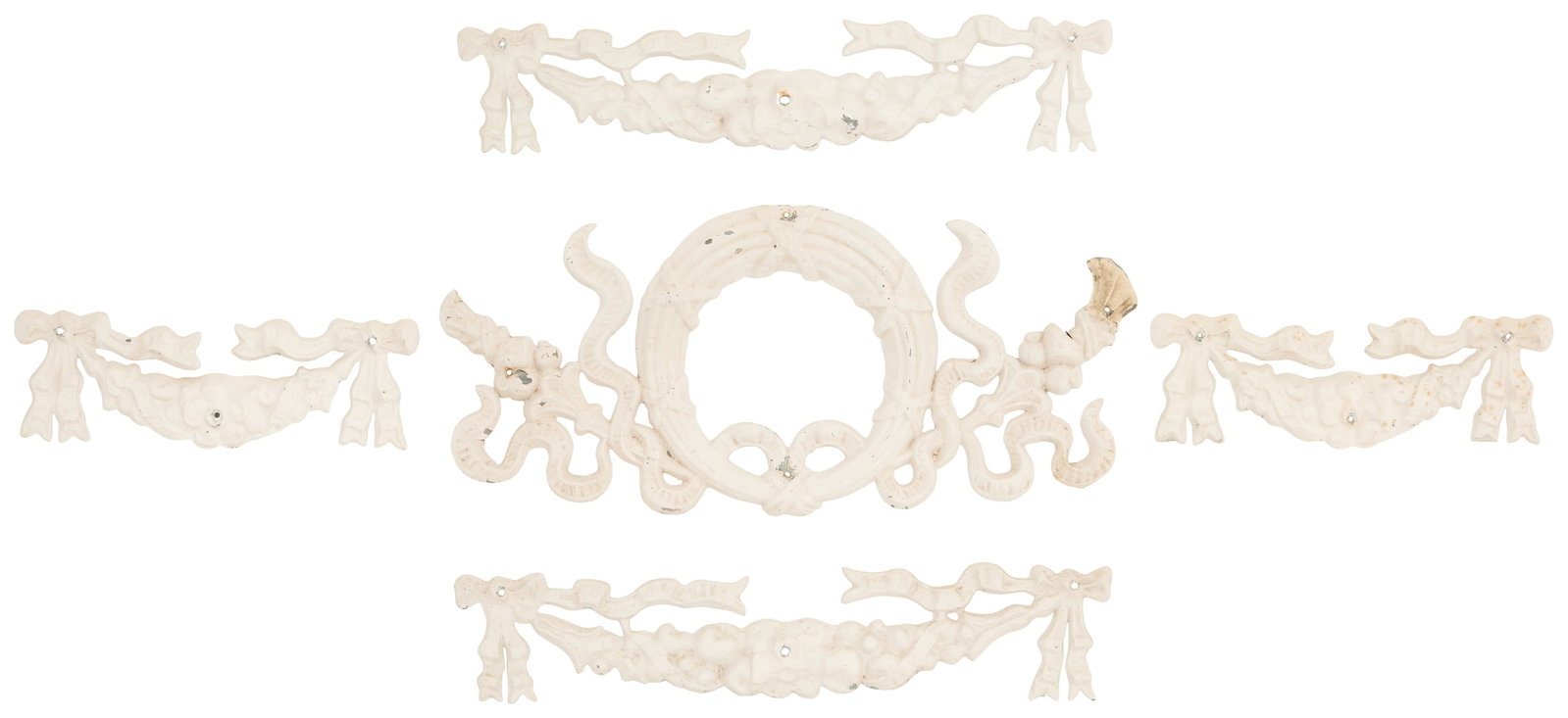 Five Molded Zinc Architectural Ornaments: Five Pieces of Molded Zinc Architectural Ornaments the collection including a ribbon-bound wreath, h. 11", w. 23-1/2", a pair of large ribbon-bound fruit swags, h. 4-3/4", w. 23-1/2", and a pair of sm
