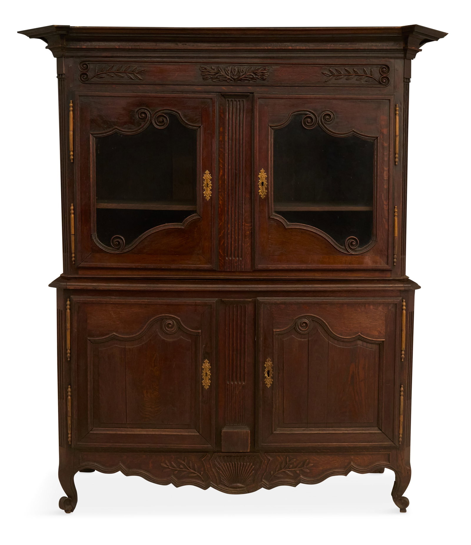 French Provincial Oak Buffet a Deux Corps: French Provincial Oak Buffet a Deux Corps 18th century, the top with a removable cornice over a scroll- and foliate-carved frieze and a pair of glazed doors, the base with a pair of framed and paneled
