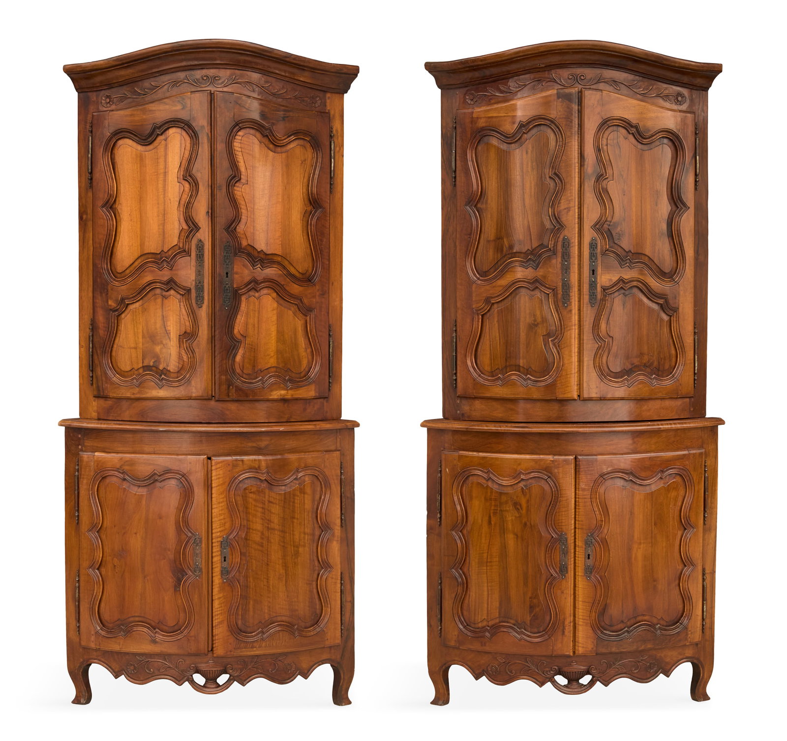 Pair of Provincial Louis XV-Style Corner Cabinets: Pair of Provincial Louis XV-Style Fruitwood Corner Cabinets 19th century, each with a bowed, molded, slightly domed cornice above a conforming case fitted with two bi-paneled doors, the lower section 