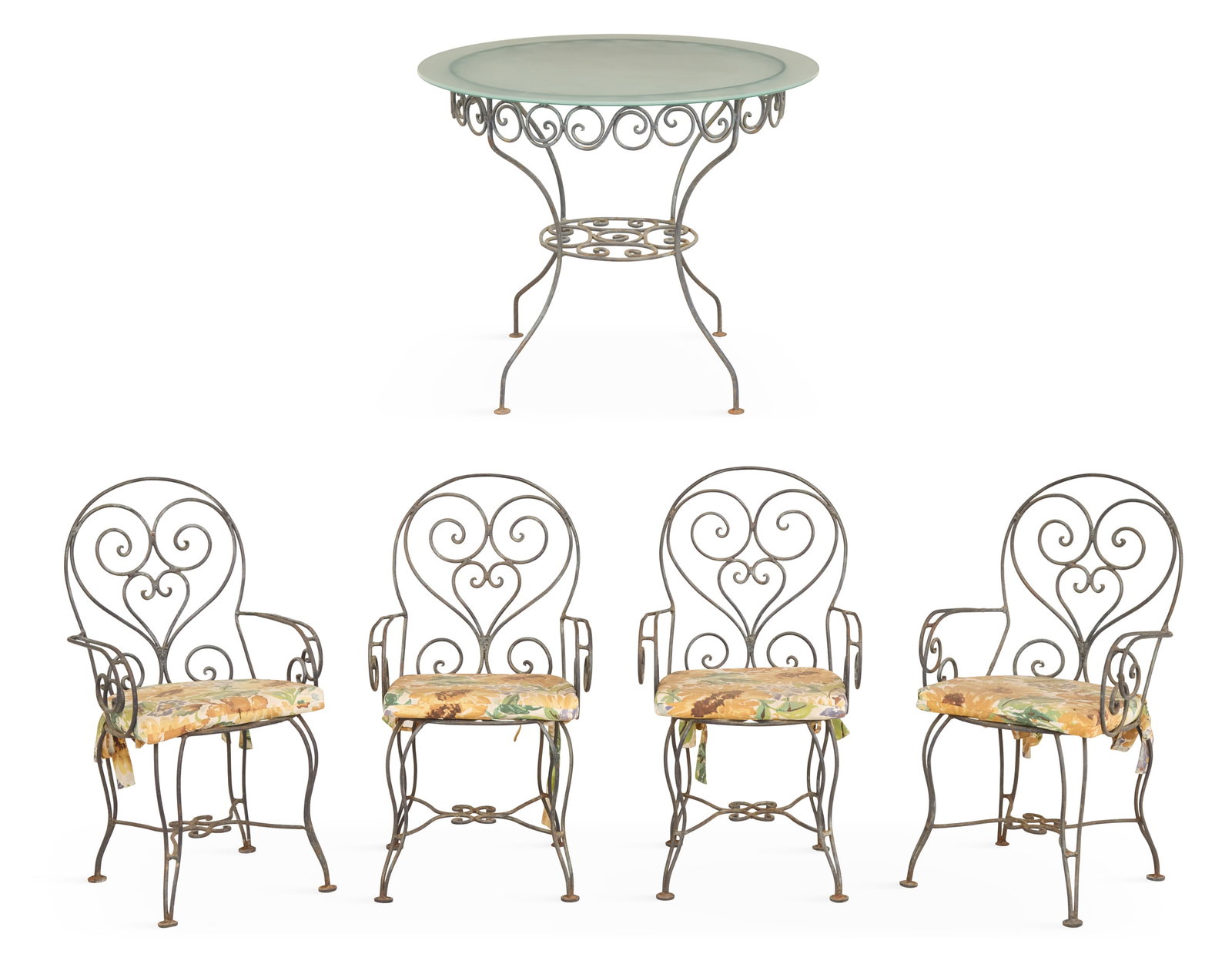 Iron and Glass Garden Table and Chairs: Iron and Glass Garden Table and Chairs 20th century, the four armchairs decorated with pierced scrollwork and raised on cabriole legs, h. 38-1/2", w. 19-1/2", d. 21-1/2", together with a matching circ