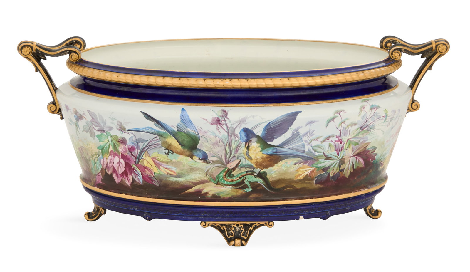 French Porcelain Jardiniere: French Porcelain Jardiniere late 19th century, Paris or Limoges, the jardiniere decorated with two birds attacking a lizard in a lush garden, on a gilt-trimmed cobalt ground, on scrolled feet, the