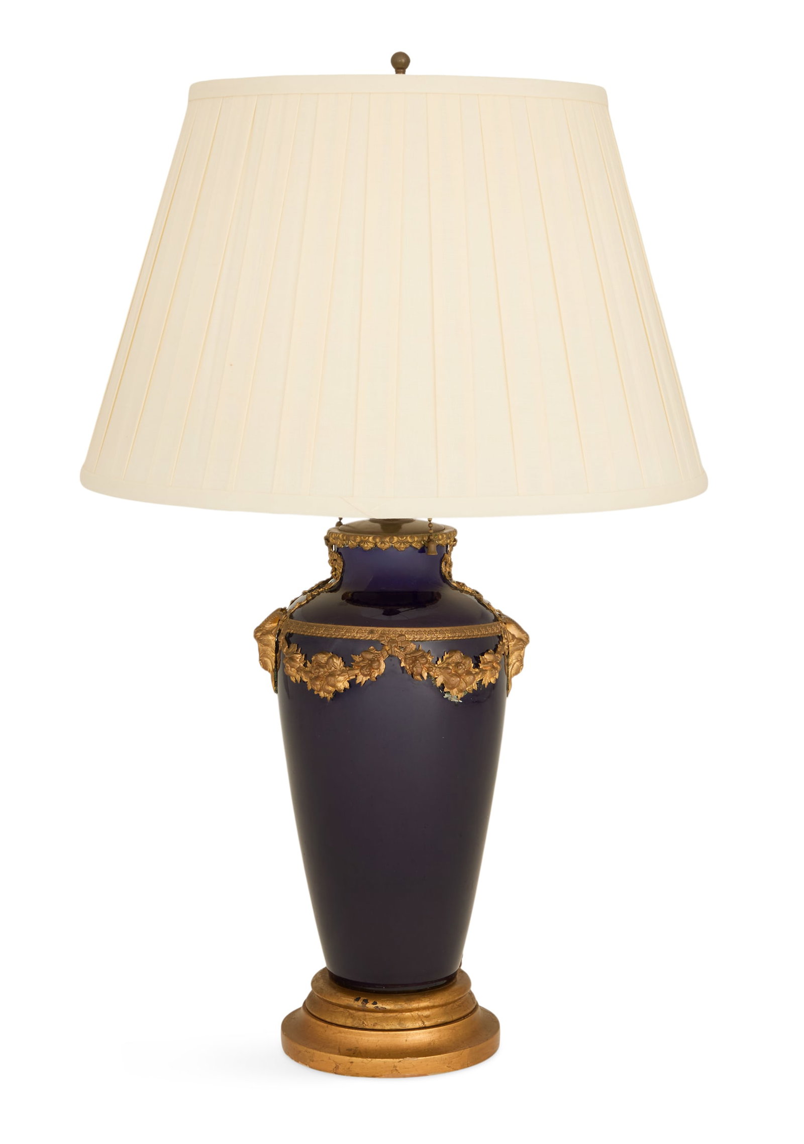 French Porcelain and Gilt-Brass Vase Lamp: French Porcelain and Gilt-Brass Vase Lamp early 20th century, the circular, tapered porcelain vase decorated with gilt-brass mounts of ram's heads and swags of flowers, now mounted on a giltwood base 