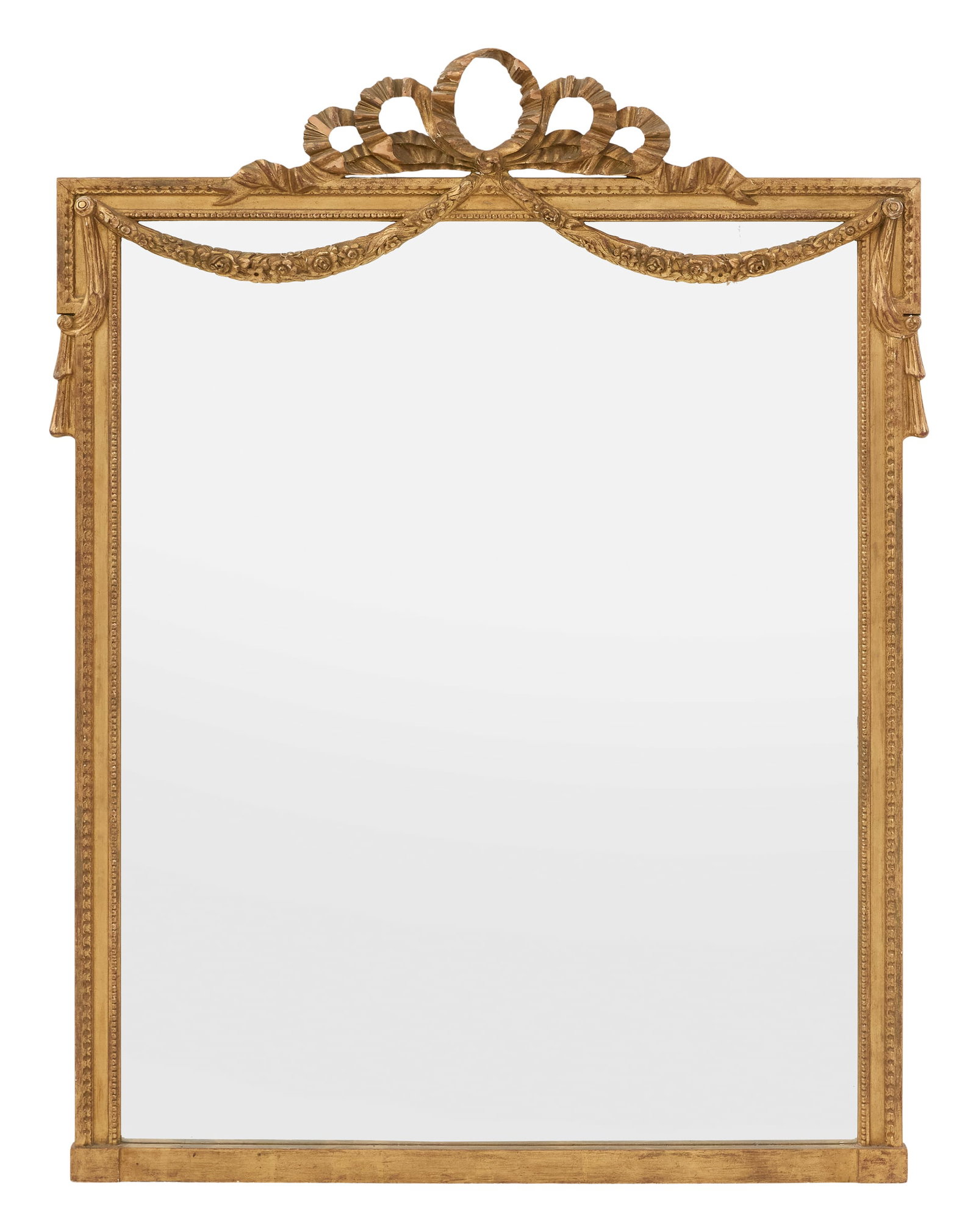 Large Giltwood Mirror in the Louis XVI Taste: Large Giltwood Mirror in the Louis XVI Taste mid-20th century, the pierced ribbon and bowknot crest supporting swags of flowers, atop the giltwood surround, with crossetted corners and carved with a