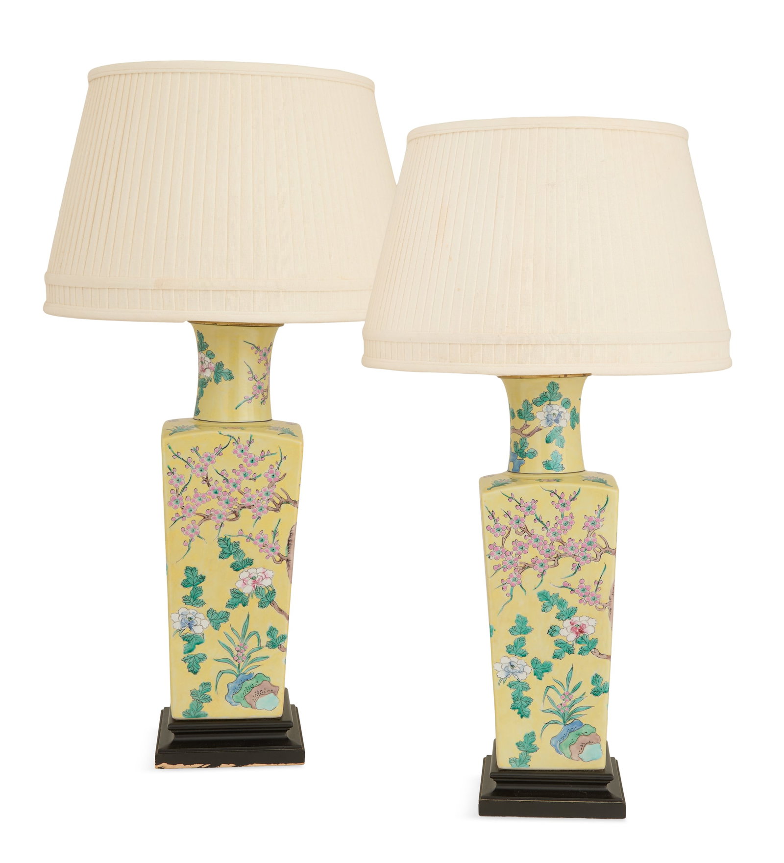 Pair of Chinese Porcelain Vase Lamps: Pair of Chinese Porcelain Vase Lamps 20th century, in the famille jaune palette, the tapered and squared vases decorated with flowering plum trees and peonies on a yellow ground, on ebonized bases