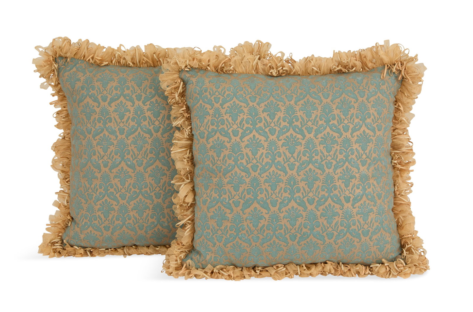 Pair of Fortuny Silk Pillows: Pair of Fortuny Silk Pillows the pillows with blue decoration on a champagne gold ground, the edges with gold chiffon trim. w. 17", l. 17"