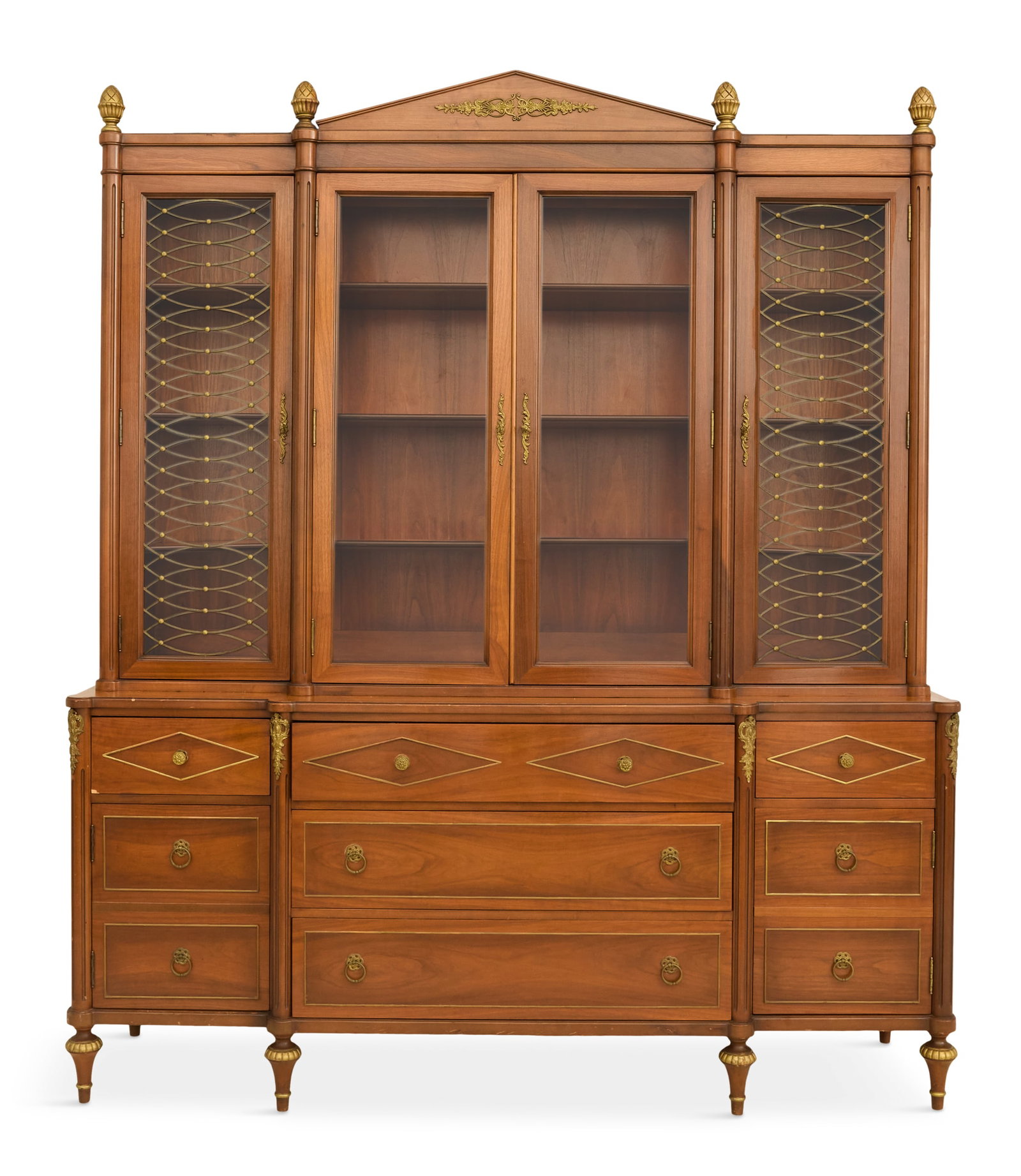 Louis XVI-Style Ormolu-Mounted Breakfront: Louis XVI-Style Walnut and Ormolu-Mounted Breakfront 20th century, the upper case with a peaked central pediment and pineapple finials to each side, over a pair of glazed odors in the center and flank