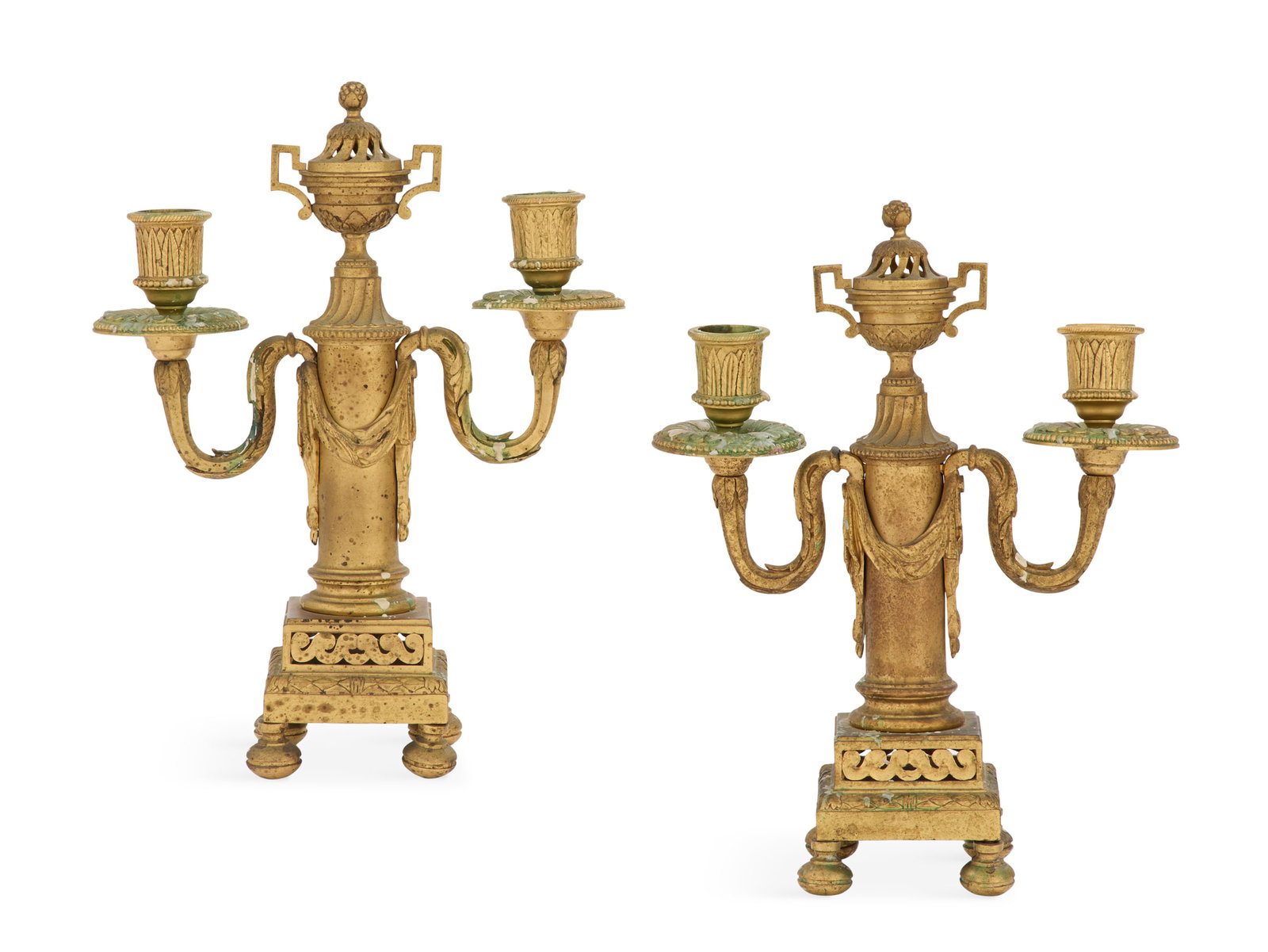Pair of French Gilt-Bronze Candelabra: Pair of French Gilt-Bronze Candelabra late 19th century, in the Louis XVI taste, the urn-form finials on column-form standards, draped in bronze swagging, the scrolled candle branches terminating in l