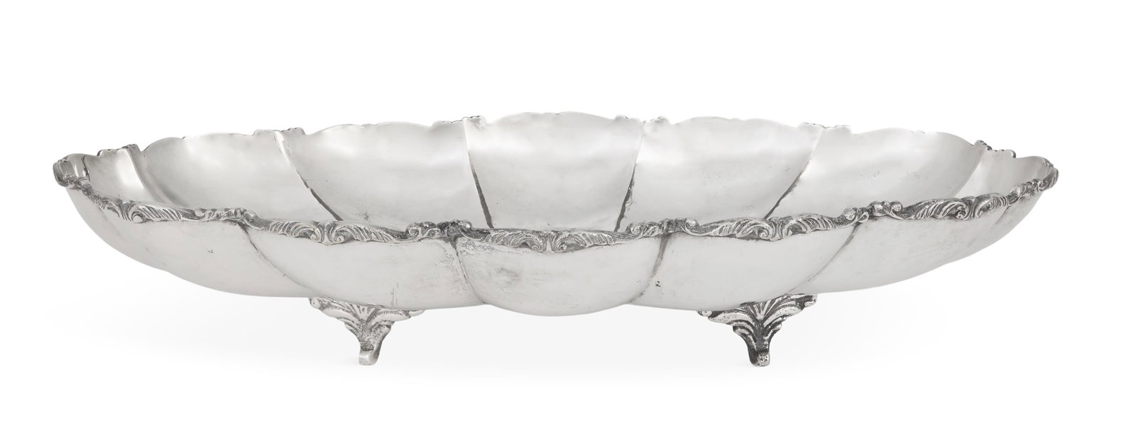 Large Central American Silverplate Center Bowl: Large Central American Silverplate Center Bowl mid-20th century, in the Spanish Colonial taste, of scalloped oval form, with shaped and applied acanthus-scroll rim and raised on four addorsed scroll f